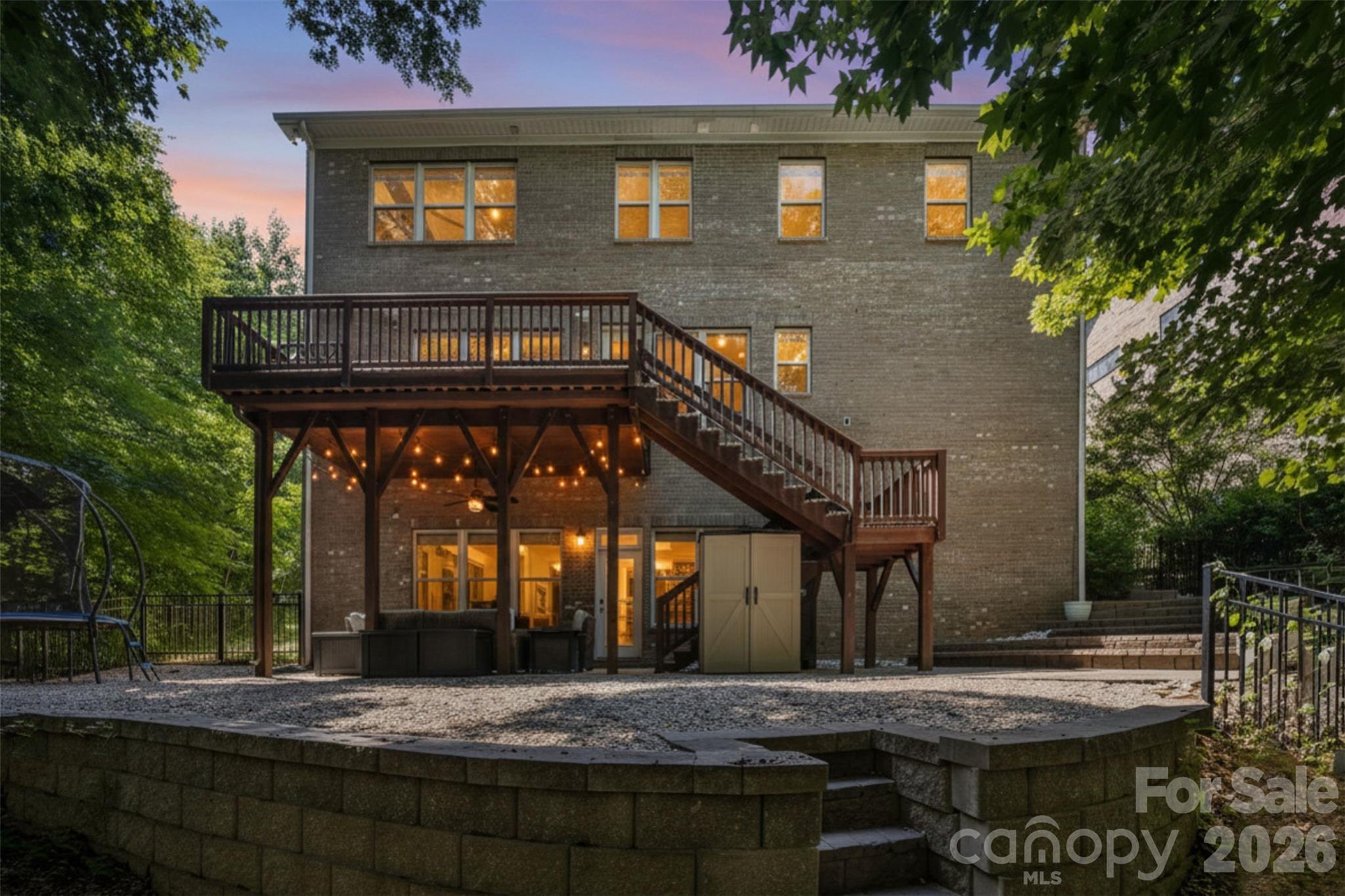 Stunning home in the highly sought-after Barber Rock community, offering an unbeatable location in the heart of Indian Land just minutes from Ballantyne and Fort Mill. Enjoy convenient access to top-rated schools, premier dining, shopping, and everyday amenities. What truly sets this home apart is the incredible indoor-outdoor living experience. The finished walkout basement creates the perfect extension of the home, featuring a private bedroom, full bath, spacious recreation room, and a dedicated movie room complete with projector and screen ideal for entertaining. 

Outside, the expansive, level front yard provides exceptional usable outdoor space for recreation, sports, and everyday enjoyment. In contrast, the backyard serves as a private, low-maintenance retreat surrounded by mature trees and a peaceful wooded backdrop. Enjoy year-round entertaining from the covered patio, spacious deck and dedicated fire pit area, all thoughtfully designed to maximize enjoyment while minimizing upkeep.

Inside, the main level offers an open and inviting floor plan with rich hardwood floors and thoughtful design throughout. The spacious living room with gas fireplace flows seamlessly into a well-appointed kitchen featuring a gas cooktop & oven, large island, pantry, and stainless steel appliances. A formal dining room, private office, and bright breakfast area complete the main level. 

Upstairs, the expansive primary suite features a spa-like en-suite bath with garden tub, walk-in shower, and generous walk-in closet. Three additional bedrooms and a bonus room provide flexible space for family, guests, or work-from-home needs.

Additional highlights include a 3-car garage, surround sound, and included security system equipment. Community amenities include a clubhouse, outdoor pool, playground, and walking trails.

Offering the rare combination of a finished walkout basement, exceptional outdoor living spaces, a private wooded setting, and a prime Indian Land location, this home delivers the space, flexibility, and lifestyle that make it truly stand out.