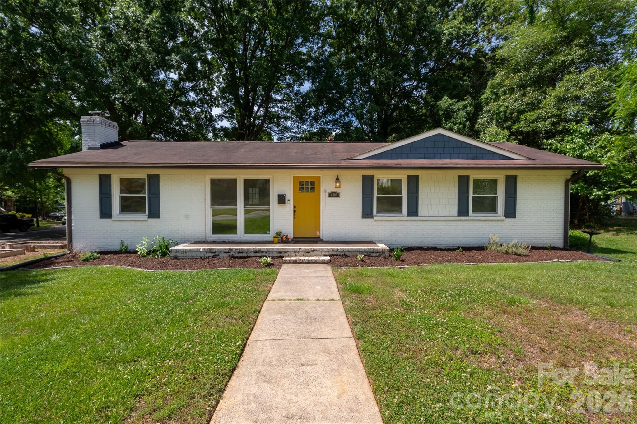 Charming 3 bedroom, 2 full bath brick ranch home on large CORNER LOT in very desirable Windsor Park neighborhood! 
Open concept with Updated Kitchen featuring stainless steel appliances, quartz countertops and contemporary style cabinets. In the Family Room you'll find a WOOD BURNING FIREPLACE and plenty of room for entertaining friends and family. Beautiful, original solid oak floors throughout the house! Primary Bedroom with Ensuite Bath. Sellers added shelving and cabinet system to one of the two additional bedrooms to make it a perfect Home Office but the space could easily be a nursery or crafting room or returned to it's original purpose. 
Outside you'll find a LARGE DECK, Firepit, Storage Shed WITH ELECTRICITY, plenty of shelving and additional storage with plenty of cut wood for use in firepit or fireplace (thank you generous sellers!). 
LARGE LOT could allow for future addition to home - something that can be hard to find in a close to Uptown location!
Close to Plaza Midwood and NODA, easy access to Uptown, many local restaurants and breweries as well as parks and walking/biking trails close by.
