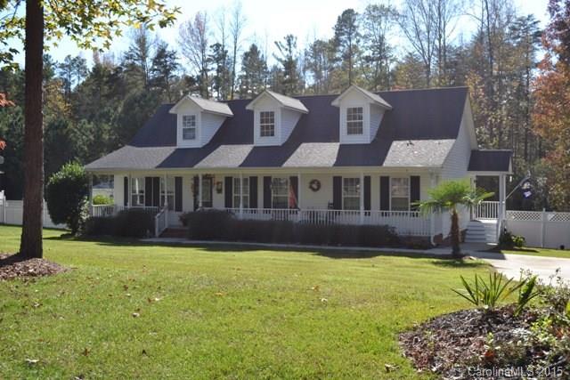 Rocking chair front porch on a huge 2.5 acre lot!  Roomy great room with beautiful hardwoods and fireplace!  Cozy kitchen with breakfast area and bar!  Large rooms and spcaious bathrooms! Privacy fencing all on sides, screened porch and deck for year round use! Nearby lake access and Waters Edge!