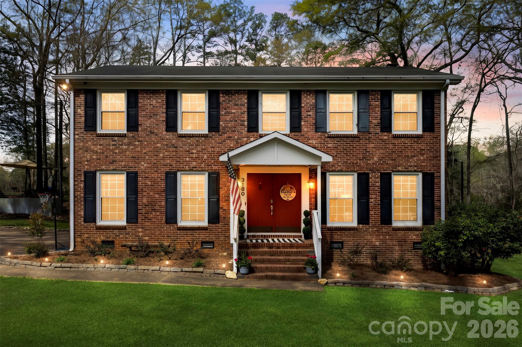 Located on the 11th fairway of the Pinetuck Golf Course, this all-brick, colonial-style home offers significant potential. Situated on a 1.88-acre lot, the property features a classic four-square design with a spacious yard and includes two additional storage buildings. The interior layout is well-suited for a variety of needs. The main level includes a Living Room, Dining Room, Den, Kitchen, Half Bathroom and Laundry. The upper level provides four Bedrooms and 2 Bathrooms. One of the highlights of the home is the screened-in back Porch, which overlooks the golf course and provides a quiet space to enjoy the Carolina weather. The home is conveniently located near the Pinetuck Club and I-77, offering an easy commute to Charlotte. While the property is ready for personal updates and touches, its foundational features and prime location make it an excellent opportunity.