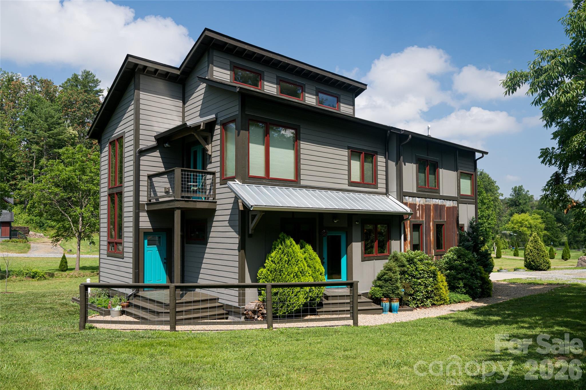 Welcome to a home where design is intentional, light is abundant, and every detail tells a story. A standout Parade of Homes winner, this property sits in one of Weaverville’s most sought-after communities, offering the rare advantage of backroad access into North Asheville, where convenience meets quiet living. Step inside and feel the difference. Soaring ceilings. Natural materials. Sunlight moving freely through an open, connected space. The kitchen anchors the home equipped with high-end appliances and a gas range flowing effortlessly into the dining and living areas, and outward to spaces designed for gathering, unwinding, and everyday living. The main-level primary suite is a retreat of its own, featuring a tiled shower and dual vanity, simple, refined, and built for comfort. Upstairs, a fourth bonus room offers flexibility for work, play, or guests. Outside, the lifestyle continues. A covered porch, a private balcony, and peaceful creek side moments create spaces that invite connection to nature, to others, to yourself. Built with purpose, this Certified Green Built home includes a sealed crawlspace and dehumidification system, enhancing both efficiency and indoor air quality. Just minutes from both downtown Weaverville and North Asheville, the location offers the best of both worlds access and escape. This isn’t just a home. It’s a place designed to be lived in, felt, and remembered. Enjoy creek access with NO water or flood damage to home from Helene.