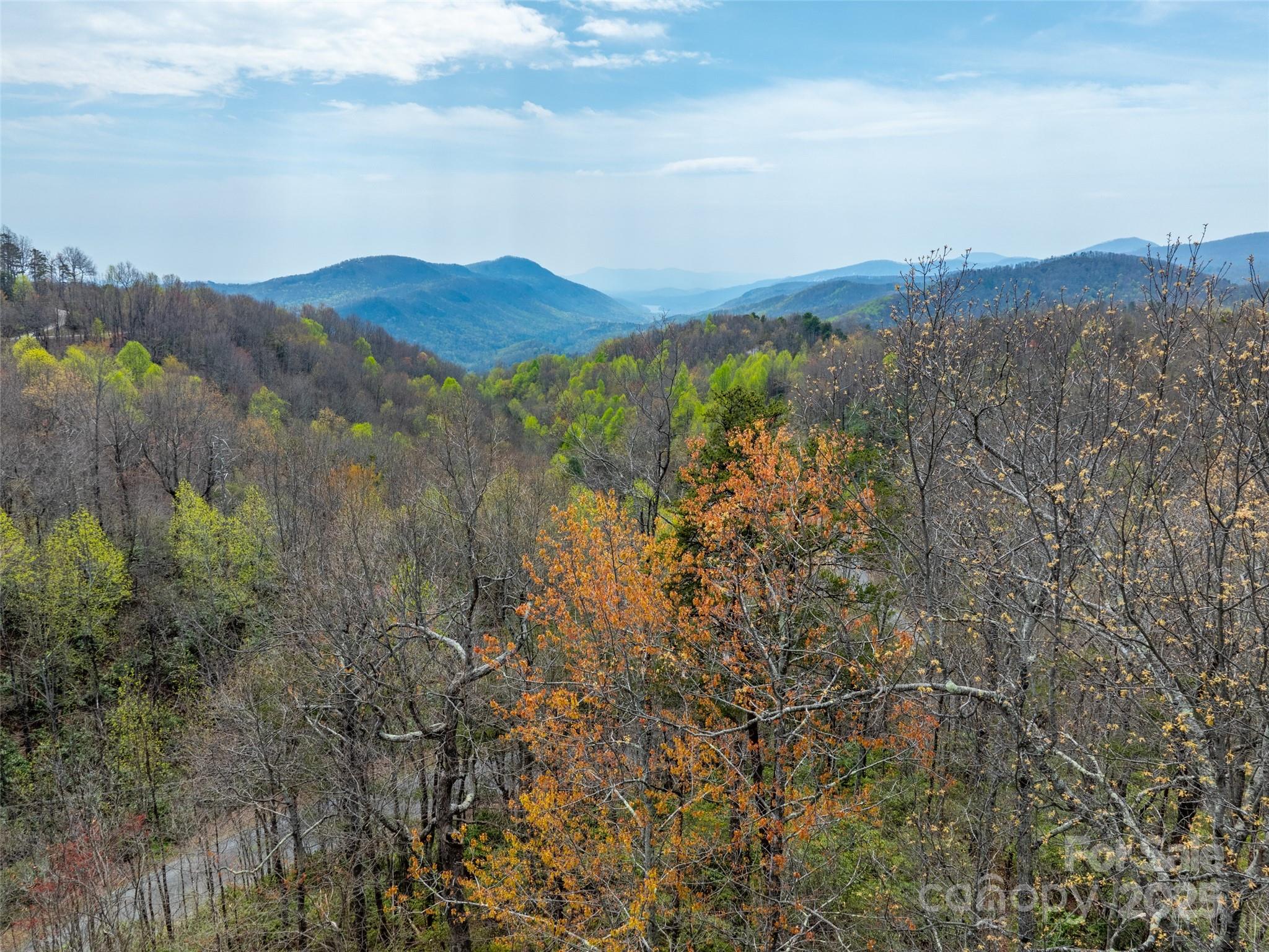 Amazing, 3 parcel lot with long range views and a creek! Priced to sell (way below tax value), this could be an excellent investment opportunity - options galore with 3 lots! Southeastern exposure and paved road access at +/-2500 ft elevation. Gateway Mountain is a 3,000+ acre, gated community in the Blue Ridge Mountains, bordering a conservancy offering an abundance of privacy. Located less than 45 minutes to Asheville, less than an hour from Hendersonville and only 15 minutes to up-and-coming town of Old Fort. This beautiful community offers hiking paths, picnic areas, a trout pond, a waterfall and a lake to swim, fish and kayak or canoe in - truly a nature lovers paradise!