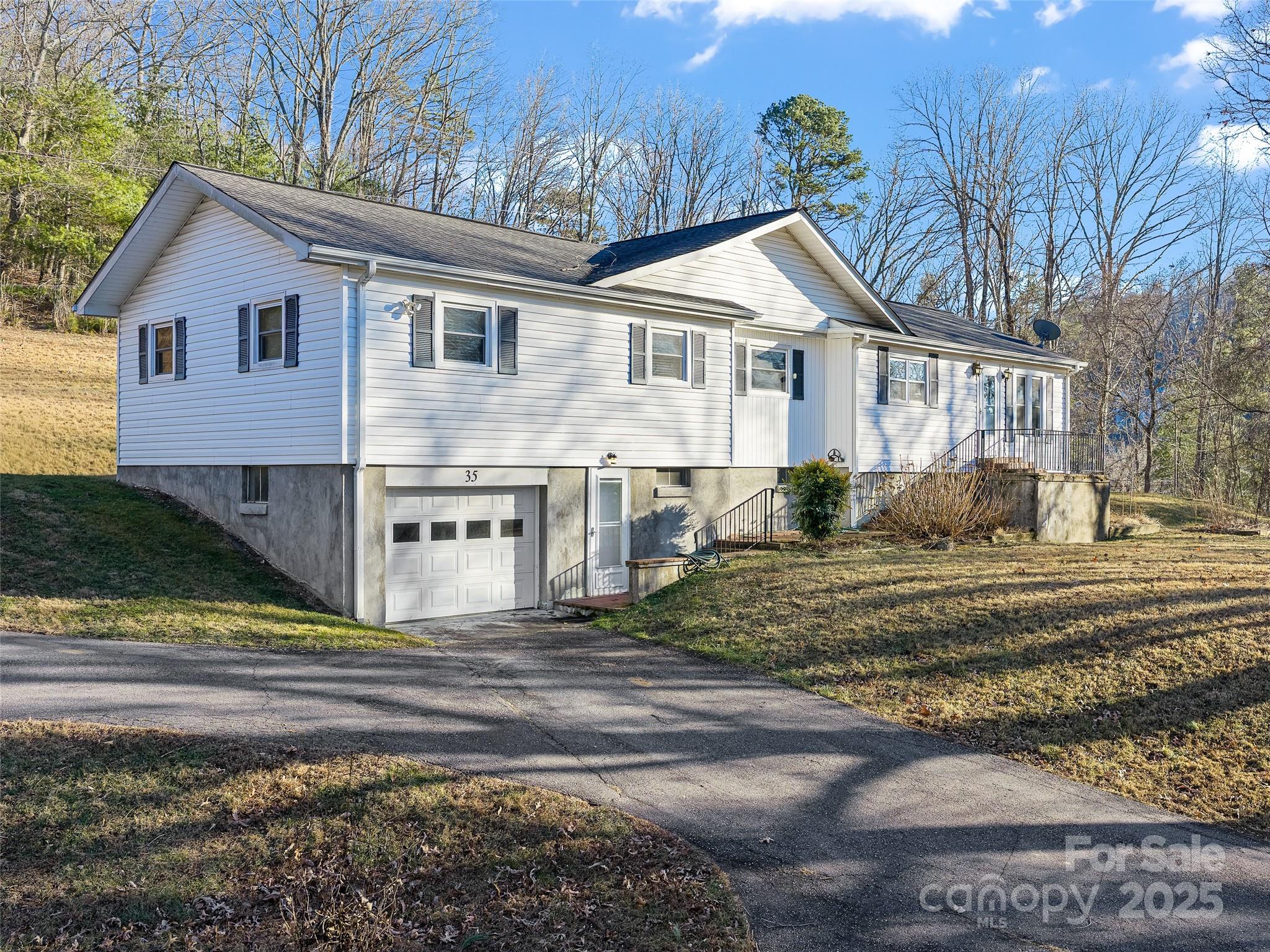 Rare opportunity to own acreage with flexibility and convenience in sought-after South Asheville! This 4-bedroom, 2 full bath, 1 half bath ranch-style home sits on an impressive 5.48 acres, offering a hard-to-find combination of usable land, strategic location, and future potential. Enjoy extremely close proximity to grocery stores, medical facilities, Sweeten Creek Road, US-25/Hendersonville Road, and the Blue Ridge Parkway—ideal for those seeking both accessibility and privacy.

The property features two very large outbuildings, expansive flat usable space, and a circular driveway with ample parking—well-suited for a home-based business, contractor, storage needs, or creative workspace. The layout and acreage provide excellent flexibility for multiple uses, while maintaining residential comfort. Nice wintertime mountain views enhance the setting, and the unfinished basement offers additional opportunity for expansion, workspace, or value-add improvements.

Properties with this much acreage so close to South Asheville amenities are increasingly rare, making this a compelling option for investors, entrepreneurs, or buyers looking for space with long-term upside.