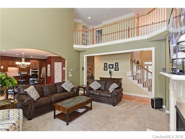 Near Ballantyne & Blakeney, & zoned for GREAT schools! Grand 2-story foyer, formal LR & DR, family room w/FP, wood floors, detailed moldings, tray ceilings, built-ins, archway details. Kitchen w/SS appliances, granite counters, tile backsplash, breakfast bar island. Master retreat w/sitting/office, bath w/his-and-hers vanities, tub, shower. Finished basement  w/2nd living area, rec room, full bath. Great outdoor space, including fenced yard, screened porch, deck, & patio. 5 min to shopping!