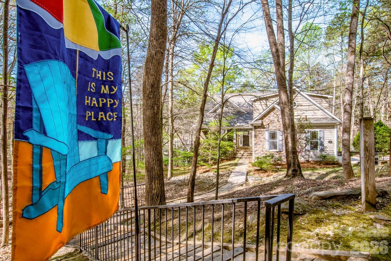Own a custom-built Lake Norman waterfront home on a private 1.26-acre wooded lot, with a rare opportunity to acquire adjacent waterfront acreage for a combined 1.95-acre estate featuring approximately 364 feet of shoreline. Tucked away at the end of a cul-de-sac, this one-owner property offers privacy, flexibility, and the opportunity to create a truly exceptional lakefront retreat.

The home features a warm and inviting main level with a fireplace that opens to the family room and kitchen, creating an ideal gathering space for family and friends. The primary suite is conveniently located on the main level and includes a walk-in tub, separate shower, and walk-in closet. Upstairs, a spacious bonus room provides flexibility for a home office, hobby room, or additional living area.

The daylight basement offers tremendous versatility with a second full kitchen, open family room with wood stove, two bedrooms, two full bathrooms, workshop, and abundant storage—ideal for extended family, guests, or multi-generational living. Oversized sinks have been thoughtfully installed in both kitchens, the laundry room, and workshop. A new architectural roof has recently been installed.

Outdoor living is equally impressive, with a screened porch, multiple decks, and a covered floating pier providing direct access to Lake Norman. Good water depth is indicated by the lake contour lines, making this an ideal setting for boating, fishing, and enjoying the lake lifestyle.

The adjacent waterfront lot is also available for purchase, creating the potential for a combined 1.95-acre waterfront estate with approximately 364 feet of shoreline. Existing deed restrictions would apply. This unique offering provides opportunities for expansion, additional construction, enhanced privacy, or creating a family compound.

Seller has priced this home competitively and is committed to a successful sale. Buyer incentives may be available, including assistance with closing costs and/or a mortgage rate buy-down with an acceptable offer.

For buyer awareness, the current driveway access crosses the seller's adjacent lot. The seller will consider providing a credit during negotiations to allow flexibility for future driveway modifications or improvements. The road serving the property is currently maintained by neighboring property owners and does not have a written road maintenance agreement.

Conveniently located just off River Highway, the property is expected to benefit from ongoing roadway improvements designed to enhance access to Mooresville and Interstate 77. Enjoy the privacy and freedom of lakefront living with NO HOA while remaining just minutes from shopping, dining, and everyday conveniences.

Schedule your private tour today and discover the possibilities this unique Lake Norman waterfront property has to offer.