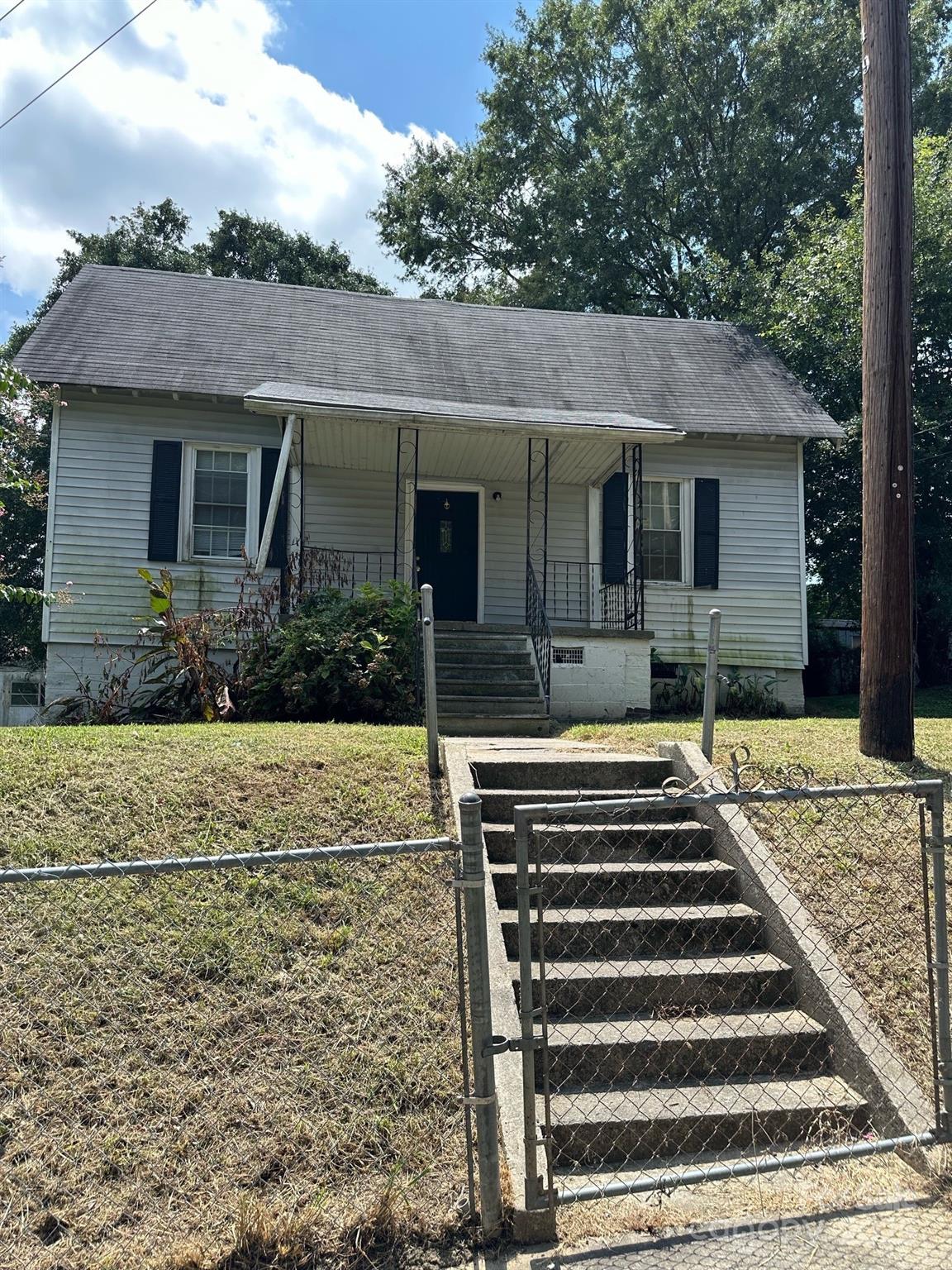 Gastonia investment potential! Come see! This home offers a private driveway, fenced yard, and deck on back. Home is sold as-is.
