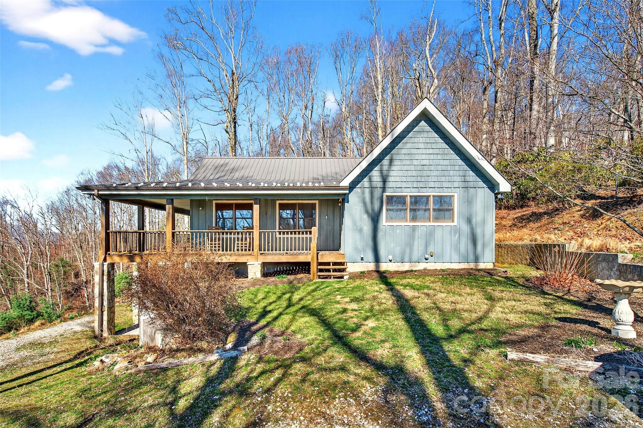Motivated Seller! 
Beautifully maintained home perched in the desirable Humpback Mountain community, set on 4.37 acres just minutes from the Blue Ridge Parkway. The main level features 1 bedroom, 1.5 bathrooms, walk in closet, an eat-in kitchen, and a spacious living room with vaulted ceilings and a stunning stone fireplace. The finished basement offers an additional bedroom and full bathroom, along with a laundry area, a cozy nook ideal for a home office or sewing space, and a second living area with a beautiful stone gas log fireplace. Enjoy multiple mountain views including Table Rock and Mount Mitchell with breathtaking sunrises and sunsets.