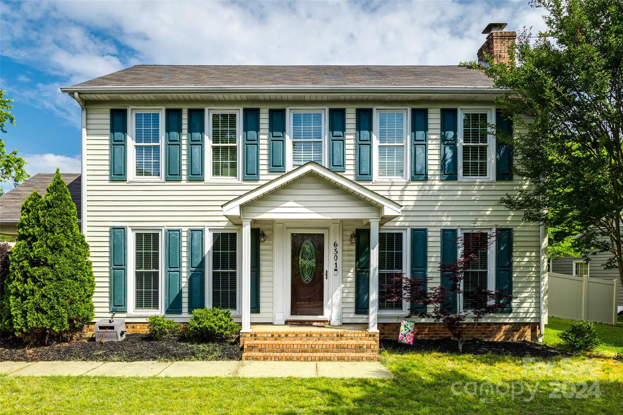 Welcome home to this 3 BR, 2.5 BA Colonial Style floor plan with laminate wood and tile floors throughout the main entertainment areas. The spacious kitchen with ample cabinet and countertop space has a breakfast nook and meets the dining room and living room adorned with a fireplace. Loads of natural light in this well designed floor plan. All bedrooms on the second floor. Owner's suite includes an ensuite complete with a walk-in closet. The fenced yard offers privacy and an inviting seating area to enjoy the Carolina Seasons. This home's location is ideal as it is minutes from The Ballantyne Bowl, highway access, and convenience to grocery stores, entertainment and recreation.