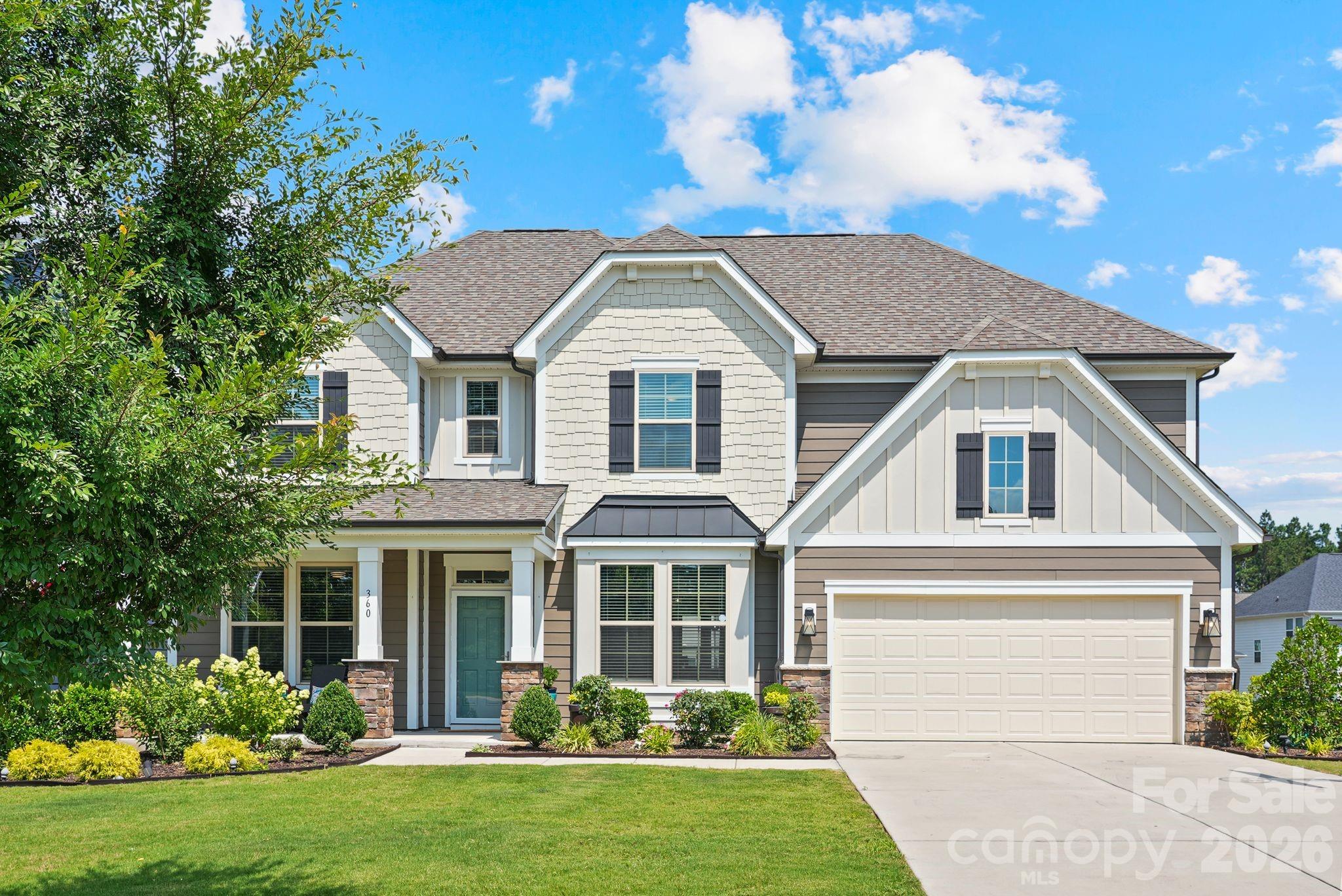 Welcome to highly sought-after Paddler's Cove in beautiful Lake Wylie, South Carolina! Built in 2022 and meticulously maintained, this stunning Stonefield floor plan offers the perfect blend of timeless design, modern finishes, and exceptional functionality. Better than new construction, this move-in-ready home offers all the benefits of a newer home without the wait.

Designed with flexibility in mind, the main level features a private guest suite complete with an en-suite full bath—ideal for guests, multi-generational living, or a private retreat. A dedicated office with French doors provides the perfect work-from-home space, while the elegant formal dining room with a tray ceiling and Butler's Pantry is ready for everything from holiday gatherings to intimate dinners. A convenient powder room completes the main level.

At the heart of the home, you'll find an impressive gourmet kitchen designed to bring everyone together. Featuring an oversized island with seating, Quartz countertops, white cabinetry, stainless steel appliances, a 5-burner gas cooktop, wall oven and microwave, designer range hood, farmhouse sink, tile backsplash, and a spacious walk-in pantry, this beautifully appointed kitchen opens seamlessly to the expansive family room, where a cozy gas fireplace and an abundance of windows create a bright, welcoming atmosphere.

Upstairs, escape to the spacious primary suite featuring a tray ceiling and a luxurious spa-inspired bath complete with dual vanities, a relaxing soaking tub, semi-frameless walk-in shower, and an oversized walk-in closet. Three additional generously sized bedrooms, two full bathrooms, a versatile loft, and a convenient upstairs laundry room provide plenty of space for family and guests alike.

Step outside to the covered rear patio, the perfect place to enjoy your morning coffee or unwind after a long day. The two-car garage offers additional storage and everyday convenience.

Life in Paddler's Cove is about more than just a beautiful home—it's a lifestyle. Residents enjoy resort-style amenities including two community pools, scenic walking trails, parks, playgrounds, and easy access to the recreational opportunities of nearby Lake Wylie. Conveniently located just minutes from shopping, dining, and an easy commute to Charlotte, you'll also appreciate the added benefit of lower South Carolina taxes.

This exceptional home combines luxury, comfort, and everyday convenience in one of Lake Wylie's most desirable communities. Don't miss your opportunity to experience everything this beautiful home has to offer!