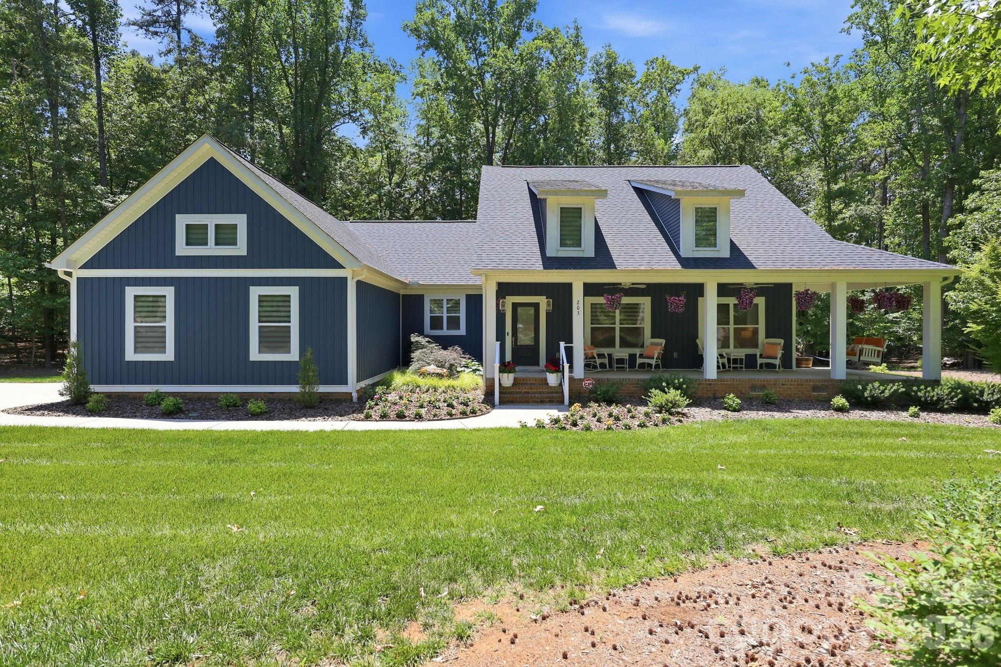 Welcome to this beautifully crafted 3 bedroom, 2 bath home in the Yachtsman’s Point neighborhood. Designed with both style and function in mind, this home offers exceptional details throughout. The heart of the home is the stunning kitchen featuring a massive island perfect for gathering, entertaining, and everyday living, along with a large custom pantry offering abundant storage. The spacious primary suite includes a custom-designed closet that adds both luxury and convenience. Enjoy peaceful mornings on the inviting rocking chair front porch or step out back to relax on the beautiful deck overlooking lush landscaping and a serene backyard setting. Yachtsman’s Point residents also enjoy neighborhood amenities including a community pool and pickleball courts. This beautiful home combines custom craftsmanship, thoughtful design, and outstanding outdoor living in a sought-after community.
