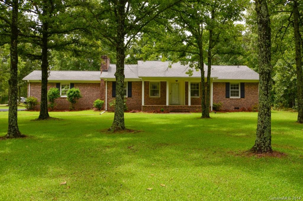 Brick ranch w/3 bedrooms and 2 full baths, formal dining, den with fireplace, eat in kitchen, mudroom and laundry, 2 car attached carport corner lot.  Outside storage and 24x36 workshop. New roof 2007, refrigerator conveys.
