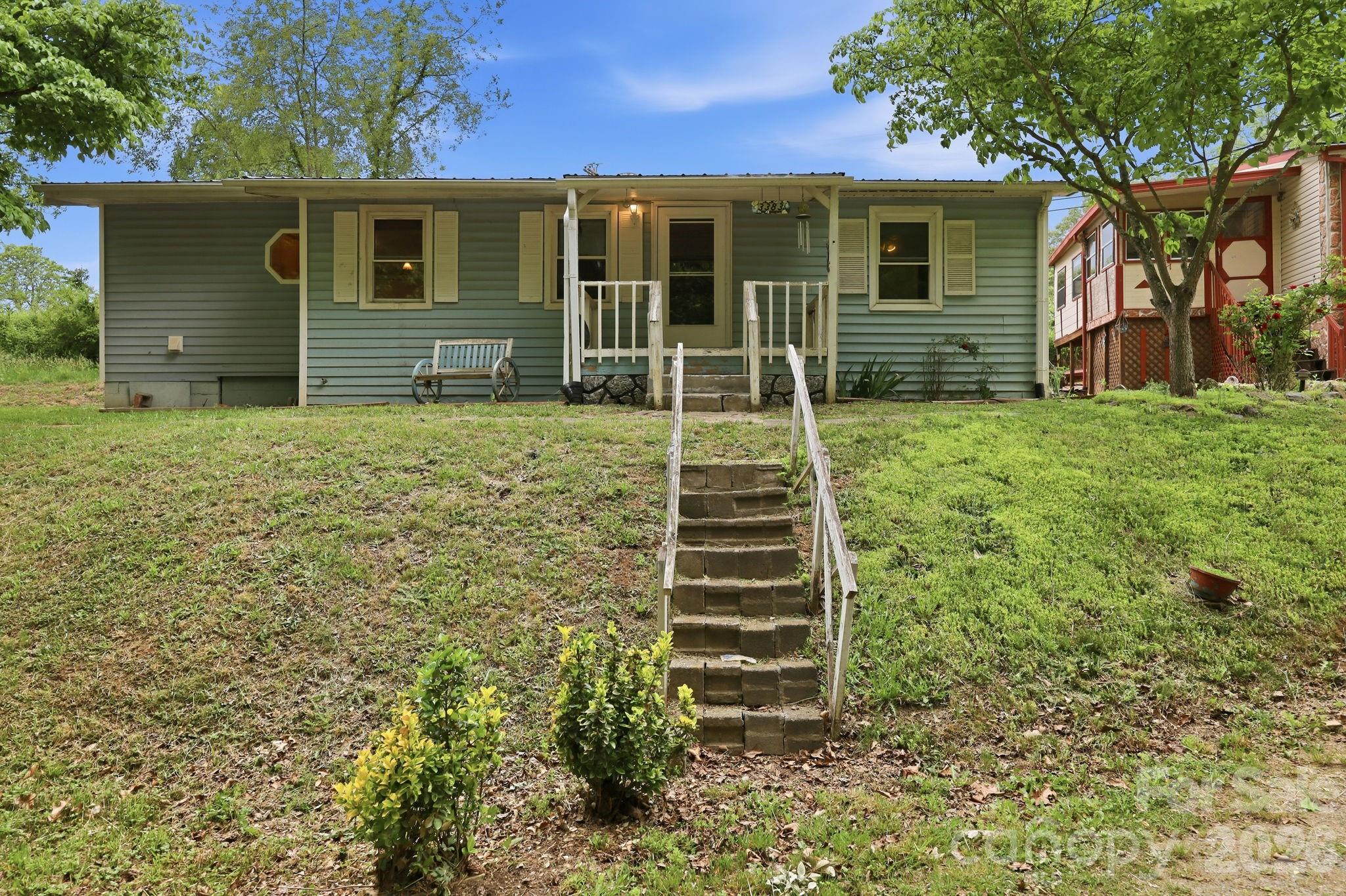 Opportunity awaits at 3383 Thickety Road in Clyde, NC! Nestled in the scenic mountains of Haywood County, this unique property offers incredible potential with two homes situated on one lot, perfect for investors, renovators, or buyers looking for additional income opportunities.

The main home features 2 bedrooms and 1 bathroom with charming wood flooring and a cozy wood burning stove that adds warmth and character to the living space. With a little vision and updating, this home could become a comfortable mountain retreat, rental property, or full-time residence.

Also included on the property is a mobile home, providing even more flexibility and potential for multi-generational living, guest accommodations, or additional rental income. The sloped lot offers a private, natural setting surrounded by the beauty of Western North Carolina.

Conveniently located just minutes from downtown Canton and less than 25 minutes from Asheville, this property combines peaceful mountain living with easy access to shopping, dining, outdoor recreation, and major roadways.

Whether you’re searching for your next investment project, a fixer-upper with upside potential, or a property with multiple living spaces, 3383 Thickety Road presents a rare opportunity to create value and make it your own. Being sold as-is. Schedule your showing today!