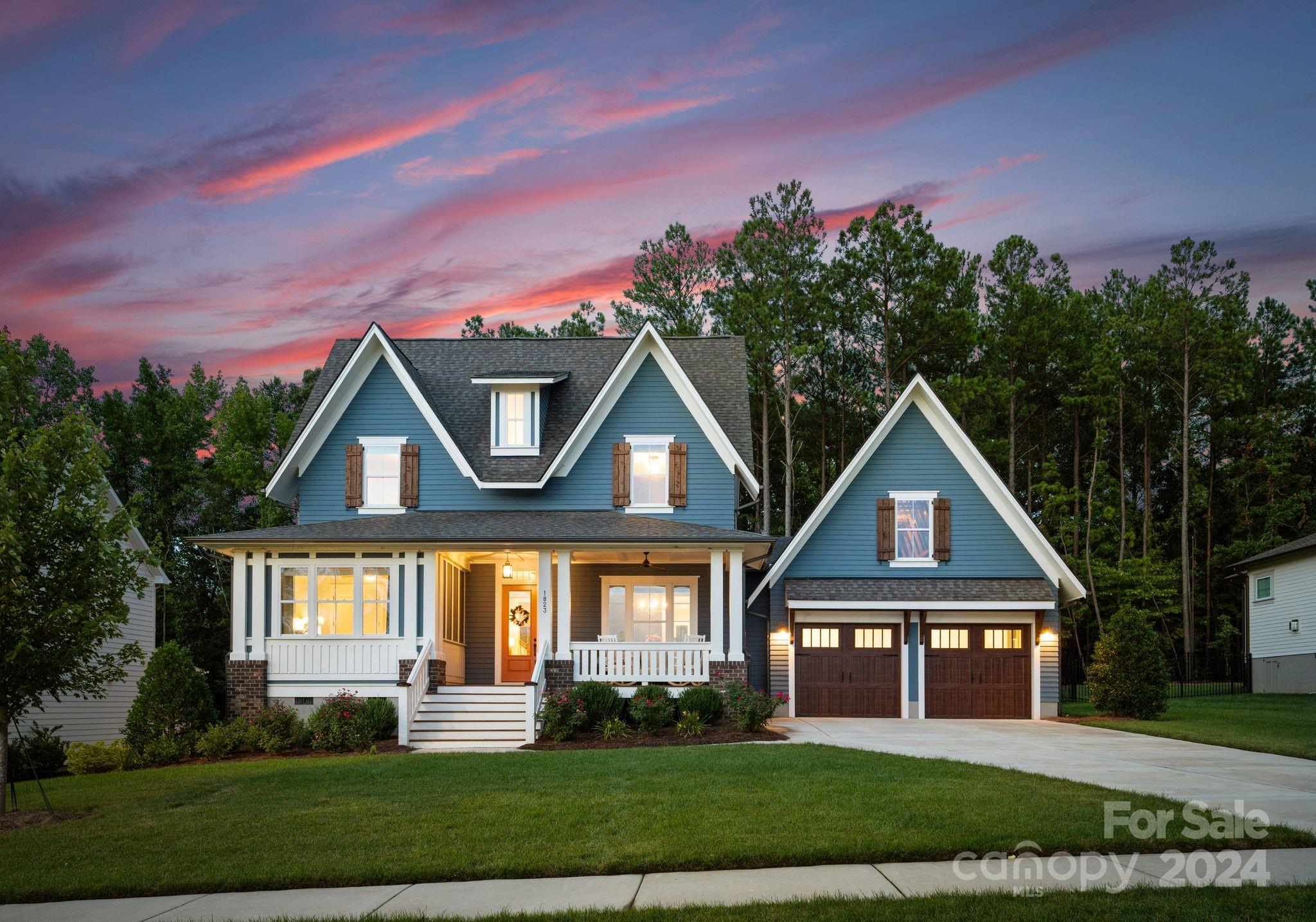 Rare opportunity to live in the highly sought after Nims Village! This exquisite, newly built home has all the upgrades one could imagine.  From stainless steel appliances to custom cabinetry the gourmet kitchen will not disappoint!  Oversized kitchen island with quartz countertops, vertical herringbone tile backsplash & two-toned cabinets stacked to the 10ft ceilings!  Stunning wooden beams add a touch of sophistication. Expansive windows creates tons of natural light!  This home features a unique blend of red hardwoods, designer lighting & elegant accent walls creating a lavish look! Oversized primary suite & guest suite both located on the main level!  Primary spa like bathroom features dual vanities, soaking tub, walk-in shower & oversized walk-in closets!  Relax next to the fireplace or on the covered front porch or back patio.  Enjoy the serene wooded, fully fenced in backyard surrounded by natures tranquility.  Prime location in Fort Mill!  Welcome home!