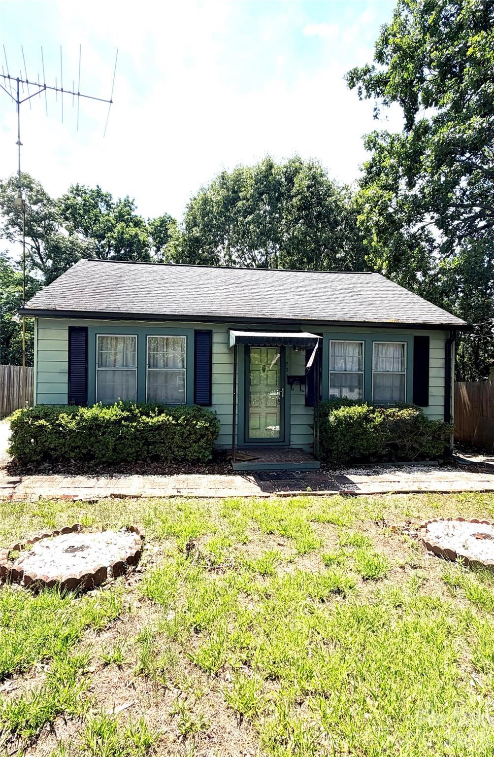 Cute bungalow for a starter home or investment property. This 2 Bed/1 Bath home is located in Hickory, near the new City Walk and downtown shopping, restaurants, and events. It has double driveways for ample parking. Inside is a large den and living room with bedrooms on the side. Kitchen, dining and bath are in the rear of house. There is a covered back deck and glass enclosed sunroom on the living room side. Fully fenced backyard with a storage building. Gas heat and air.