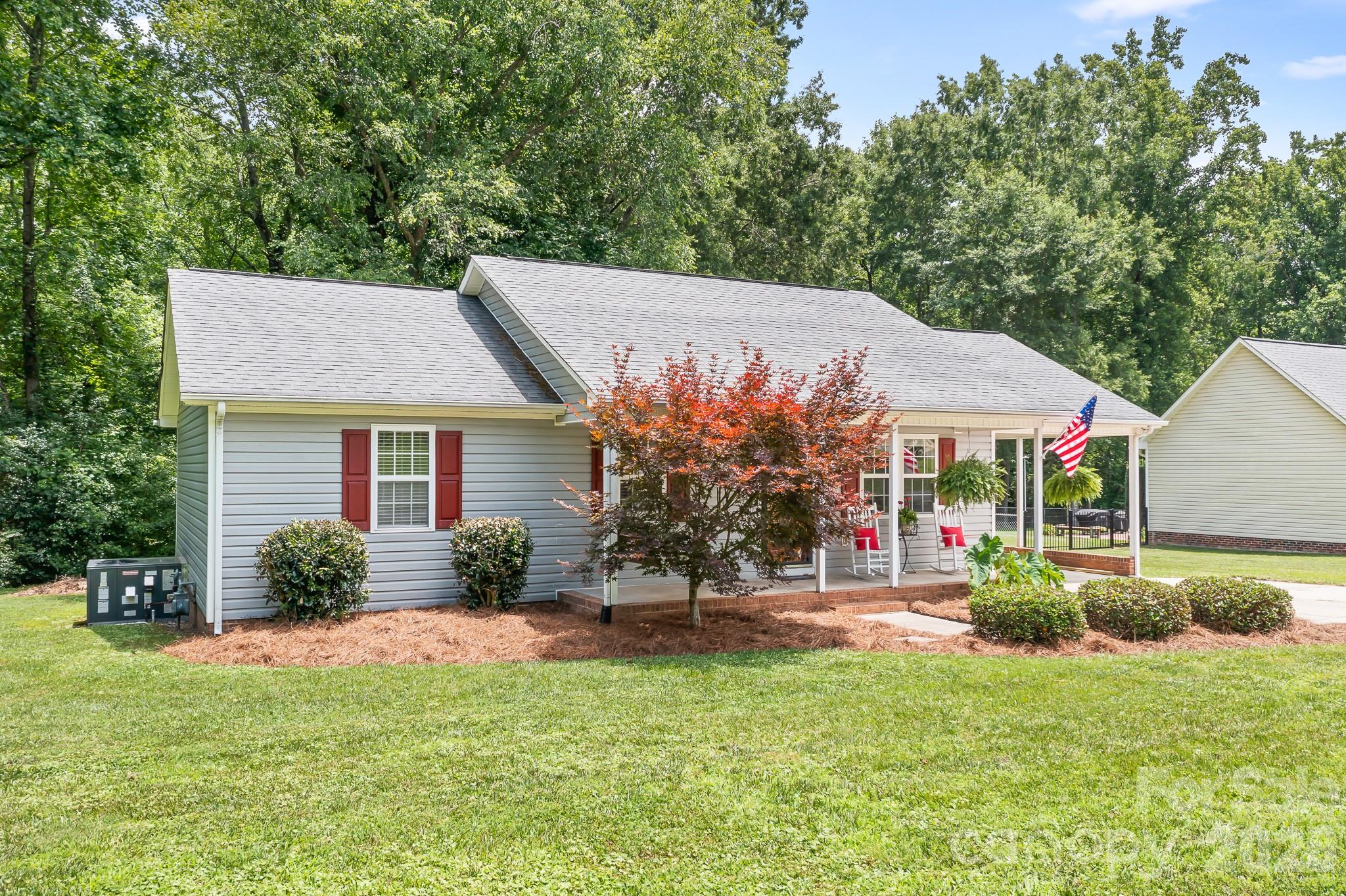 Adorable and freshly updated, this charming 3 bedroom, 2 bath home is move-in ready and waiting for its next owner! Recent improvements include new deck boards and freshly painted interior walls and trim, creating a bright and inviting atmosphere throughout. Lovingly maintained, with a heating unit new in 2022, the home sits on just under a half acre lot in the quaint town of Cherryville, offering the perfect blend of small town charm and convenient access to Charlotte. Relax on the spacious back deck, unwind in a hammock, and take in the tranquil views of the creek that meanders along the rear of the property. Enjoy the peaceful country style living while still being within reach of shopping, dining, and major commuting routes. Whether you're looking for your first home, downsizing, or simply seeking a quieter pace of life, this property offers comfort, charm, and a beautiful natural setting.