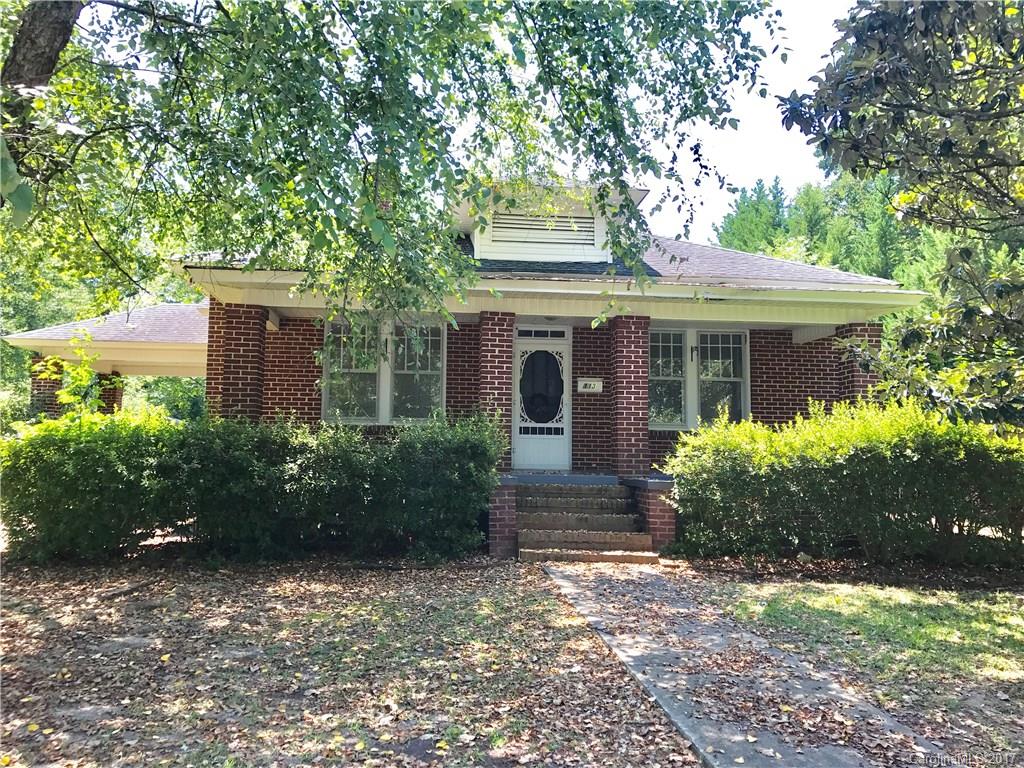 Inviting Charming Brick home looking for a new owner to love & care for it. Beautiful Virgin hardwood floors, formal DR, built in glass door hutch in eat in kitchen area. Home has so much character & needs a little TLC & decorating vision. Fenced yard Water heater less than two years old & new roof in 2009, Totally rewired in 2008. Walking distance to schools, dining-shops. Located in the award winning Clover School District. House has been well kept and is being sold AS-IS. Must see-won't last