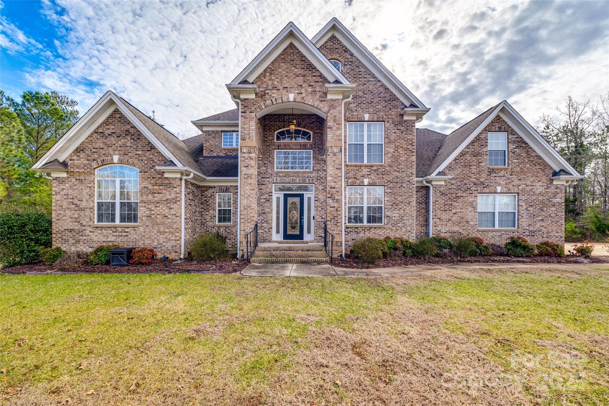Tucked away in a prestigious, sought-after neighborhood, this stunning full-brick home is a sanctuary of luxury and comfort. Nestled on over an acre of wooded land, it offers the perfect blend of privacy and serenity while remaining close to the shimmering waters of Lake Wylie and the Allison Creek boat landing—an ideal setting for water lovers.
As you step through the grand two-story foyer, you're welcomed into a beautifully designed space, thoughtfully crafted for both entertaining and everyday life. The main floor boasts a spacious primary suite, a private retreat with an en suite designed for relaxation. Recent updates include new carpet, fresh paint, modern backsplash, sleek countertops, and upgraded sinks in the kitchen and primary bath.With top-rated schools in the Clover School District and a location that balances convenience with peacefulness, this home is more than a place to live—it’s a lifestyle waiting to be embraced. Schedule your private tour today!
