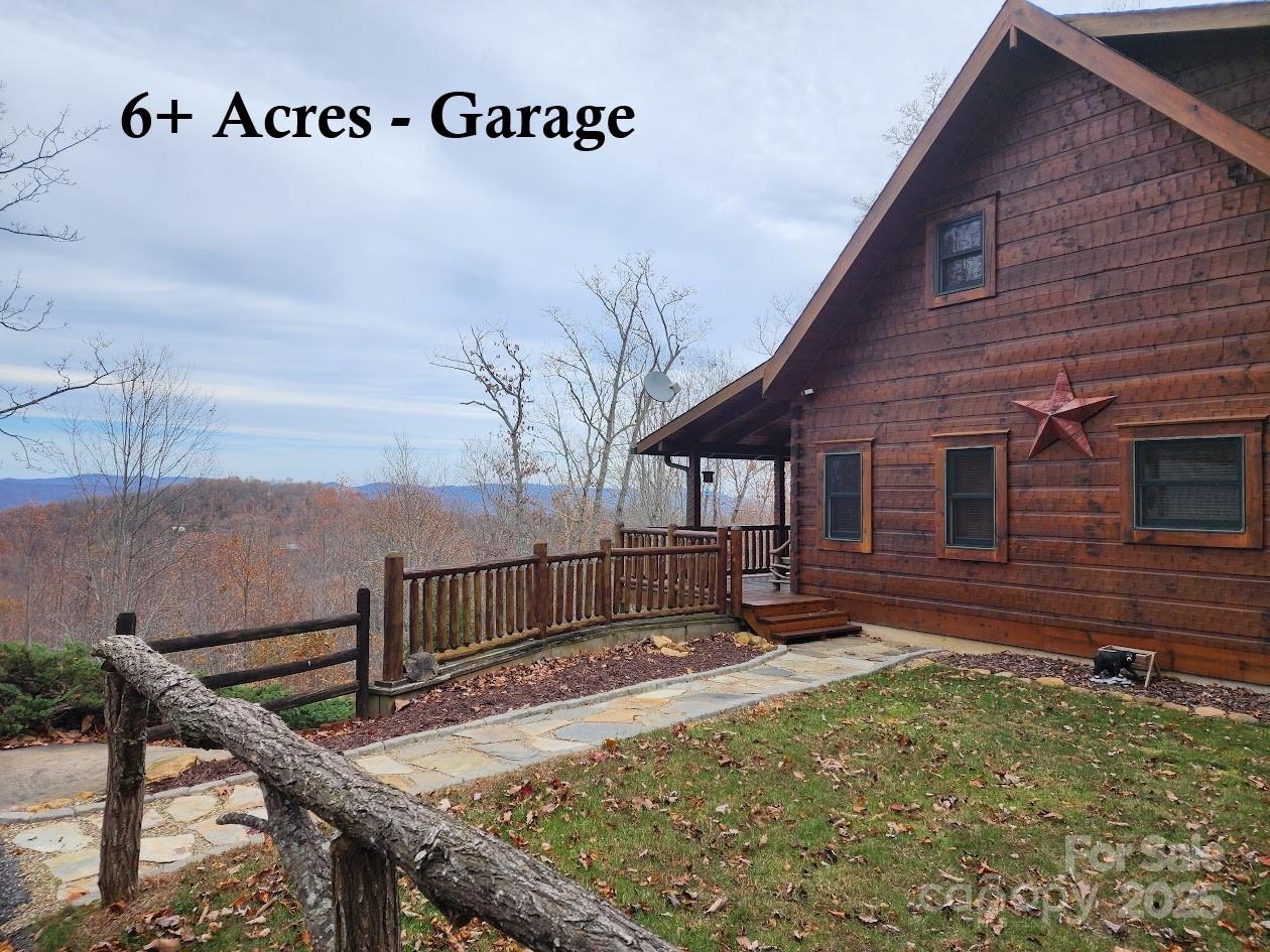 Seller says "Move This House" - Genuine JIM BARNA log home - three levels of living - 6.91 acres, 2 car Gar, Year-round-view - real stone surround WOOD BURNING fireplace…. Less than 5 miles to Yogi Bear Resort. The entry level has a large family room with a cathedral ceiling, wood burning fireplace and a loft. With true Barna style besides huge beams and pegged steps, this home has an executive trim package with fluted trims around the windows, doors, and floors. The well-appointed kitchen has a gas cooktop, Corian countertops and includes a breakfast bar. There’s a separate dining area as well as a main-level bedroom en’ suite.  Enjoy the heavy timber handrail as you go upstairs where a small loft turns to a hall with two more bedrooms and another bath. Downstairs you’ll find a second family room with a large bonus room, currently in use as a guest room with two queen beds. With a full bath, living room and laundry this lower level adds another level of living to an otherwise complete home. Away from the hustle and bustle of the city the gated mountain community, Yellowtop Mountain Estates, has all paved roads with easy access to I40, I85 and I26 and several airports. It's four season living at it's best. While this house seems very remote it's only 16 miles to Walmart!