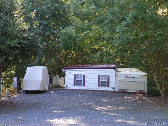 Great starter getaway!!  1984 Prowler with full room addition . Located near swimming pool, sports courts , work out center, coin operated Laundromat. Nice large deck, trees for shade. Comes furnished. New frig.