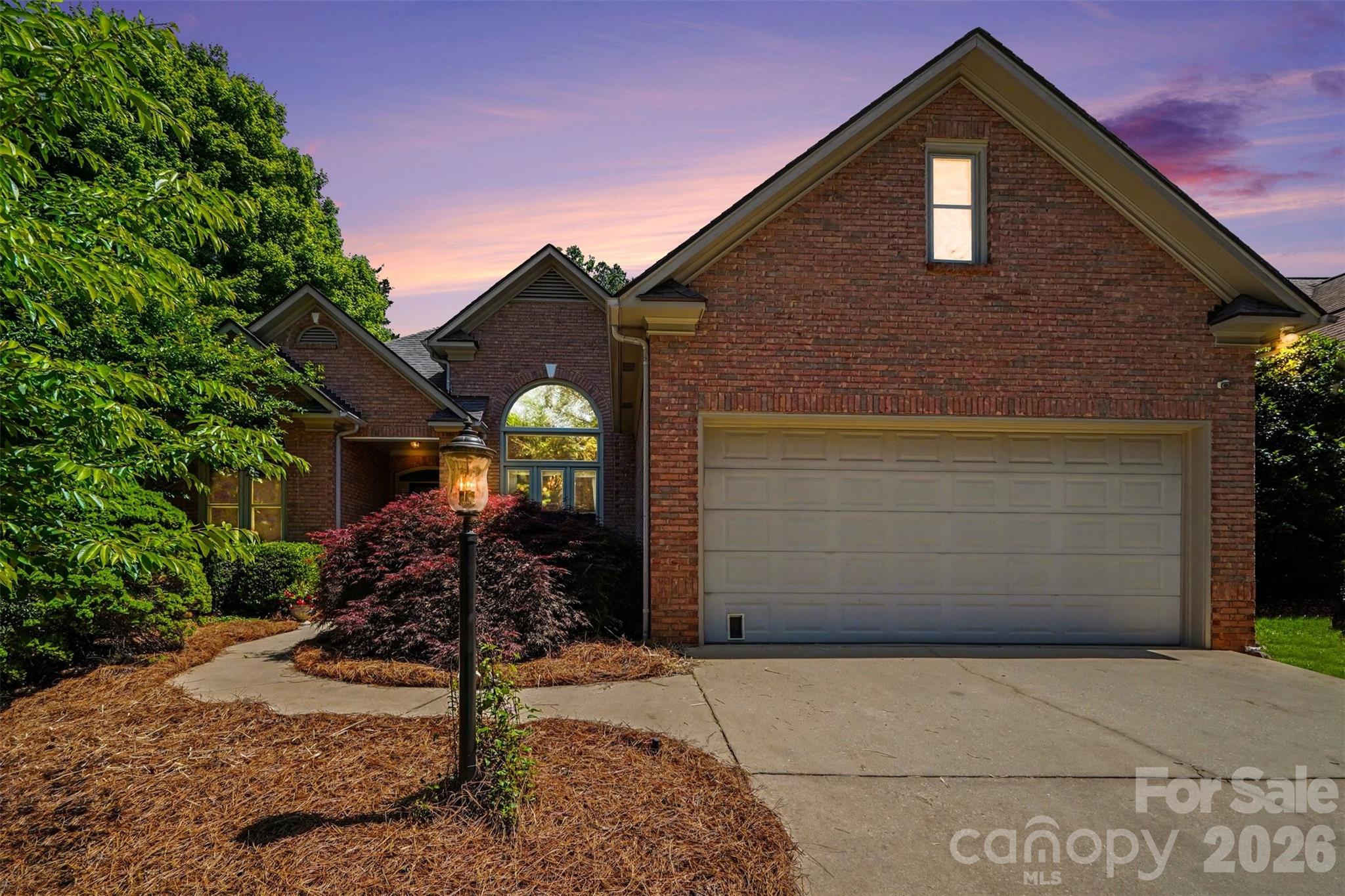 This full brick 3 BD/2 BA ranch with a split bedroom floorplan is move-in ready and thoughtfully updated throughout. The kitchen was renovated with new cabinetry, granite countertops, tile backsplash, gas stove with hood vent, stainless steel appliances, and the refrigerator & microwave will remain, opening to a bright breakfast area overlooking the screened porch. Fresh paint runs throughout the home, with new flooring in the bedrooms and a spacious primary suite that includes a private office or library nook. The primary bath features updated lighting, mirrors, cabinet hardware, and a hidden pull-out built-in, along with a tub, walk-in shower, and dual vanities.

Step outside to a truly special backyard—fully enclosed with a 6 ft privacy fence and designed like a private garden retreat that is professionally landscaped w/ blueberry bushes, butterfly bushes & year-round blooming plants. Enjoy both a large screened porch and separate paver patio, perfect for relaxing or entertaining. Additional highlights include new windows in 2025, HVAC (2018) with routine service, a Premier One UVC air purification system (2025), dehumidified crawl space with updated pump (2024), oversized 2 car garage with workspace, and a large floored attic. The washer & dryer will also remain. Low HOA at just $85/year and convenient to downtown Rock Hill, airport, shopping & restaurants!