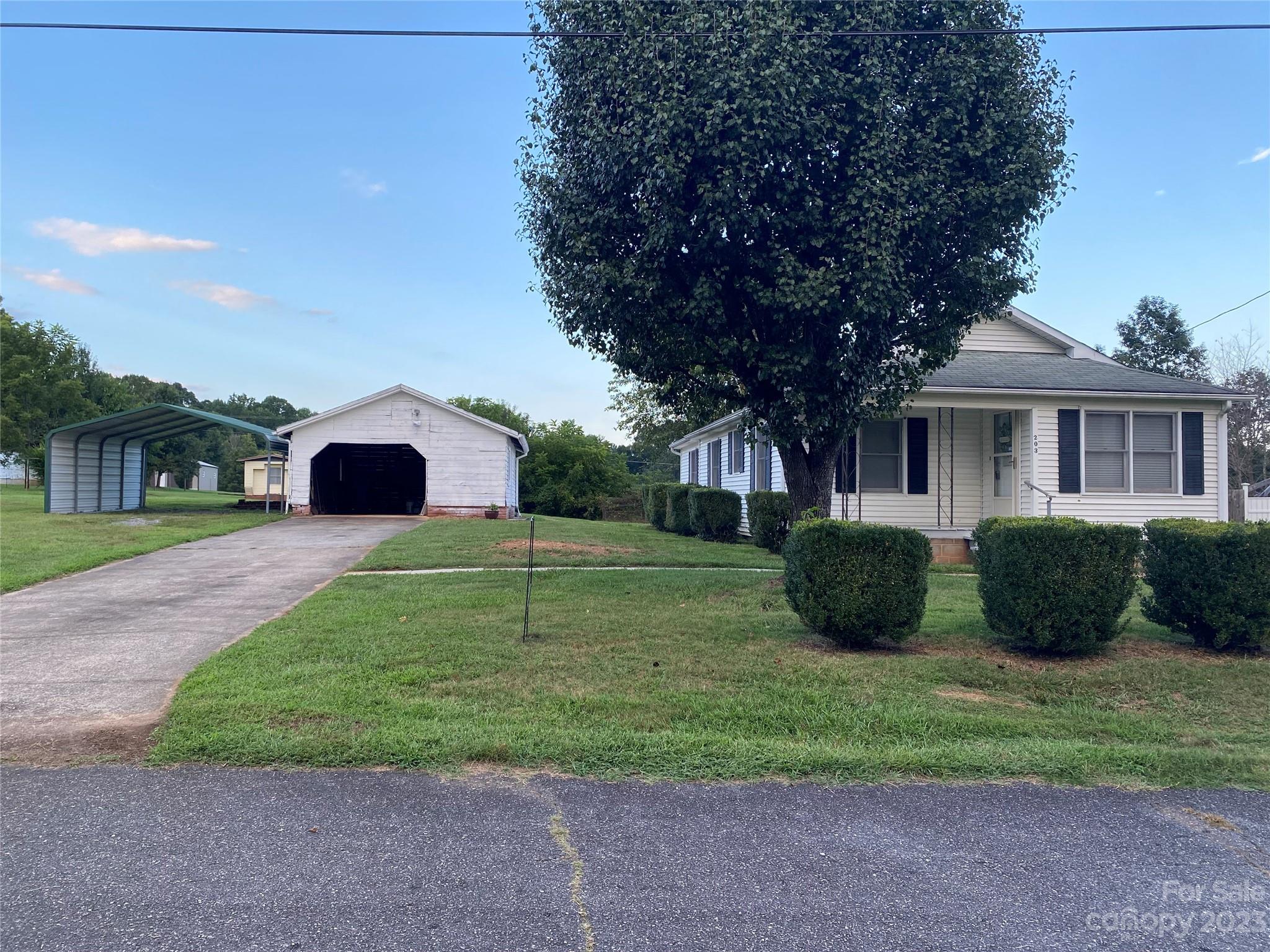 Very Well Maintained Home in Move-In Condition, This home features many wonderful updates. Floors have been updated with vinyl planks, Kitchen counters and backsplash have been redone, Bathroom has been updated, Extra room could possibly be used as 3rd bedroom but does not have a closet, Nice size laundry room with new flooring. Full basement for storage. Outside features a large level yard, covered front porch, back deck and a large patio, single garage/storage, double metal carport.