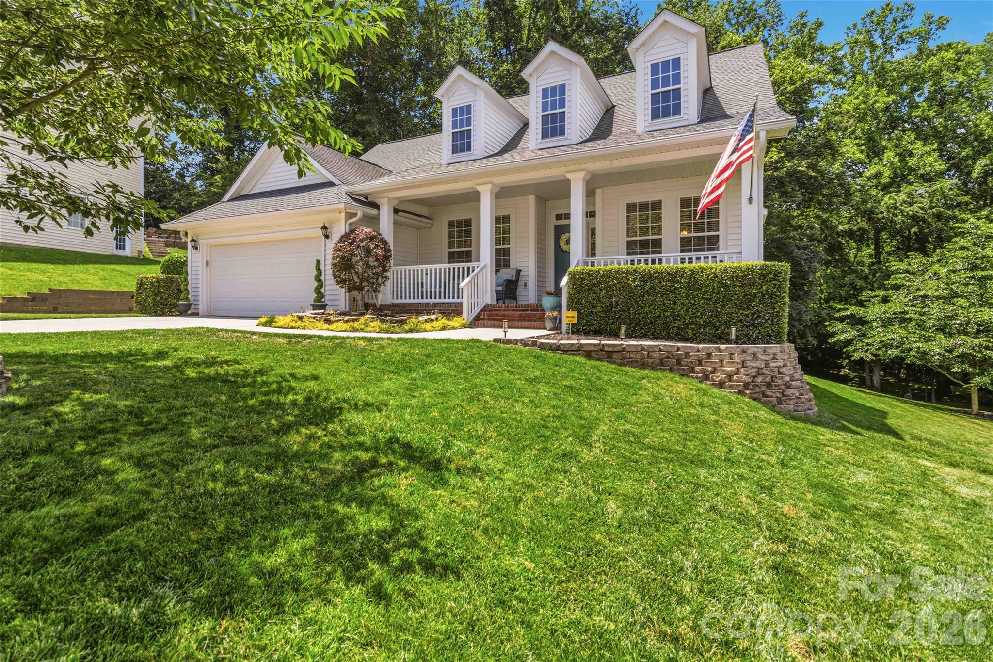 ***NEW PRICE + SELLER CONCESSION OF $25,000***This FULL WALK-OUT BASEMENT home is exceptional — but the true showstopper is the incredible backyard setting. An oversized covered rocking chair front porch welcomes friends and family as they pass the soothing water feature at the entrance. Imagine relaxing on one of THREE outdoor living areas, two of the three overlook the open firepit space and picturesque meandering creek below. Mature trees and lush landscaping create a private, peaceful retreat rarely found.

The updated kitchen and renovated primary bath feature timeless finishes, including a frameless glass shower, garden tub, dual vanities, and private water closet. The spacious walk-in closet offers custom shelving and organization.

Situated on a fabulous basement cul-de-sac lot in a highly sought-after community, this home combines comfort, functionality, and natural beauty. The main level features site-finished wood floors, formal living and dining areas, and a dramatic two-story great room with fireplace and expansive windows that flood the home with natural light and truly bring the outdoors in.

The main-level primary suite offers convenience and privacy, while the upper level — accessed by beautiful wood tread stairs — includes three additional bedrooms and two full baths. The basement provides flexible living space, including a separate area ideal for a fifth bedroom or guest suite, along with a full bath (no closet or egress - not counting as a true bedroom).

Several items convey, including the pool table, basement entertainment center and bar, and kitchen refrigerator. Additional features include full-yard irrigation on a separate meter and hot tub hookup under the patio.

Community amenities include a pool, clubhouse, and overflow vehicle/boat storage, with a nearby boat landing adding even more appeal to this lifestyle-focused property.