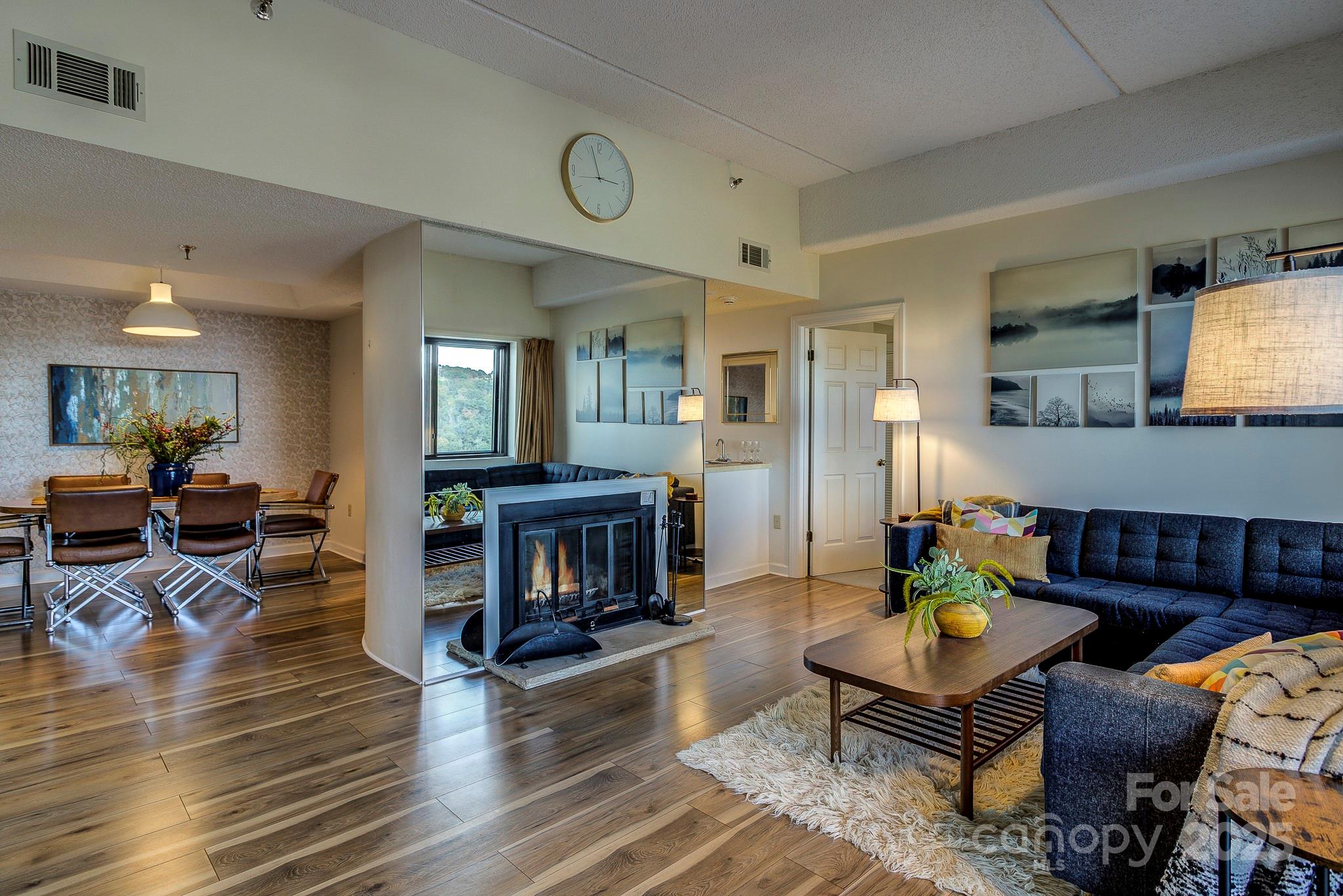 Perched at over 5,000 feet, this mid-century-inspired condo combines style with stunning views. From your spacious deck enjoy Sugar Mountain’s ski slopes to the left and long-range layered vistas to your right-you’ll truly feel on top of the world. The open-concept 2-bedroom, 2-bath layout includes an in unit washer and dryer and is sold fully furnished (with a few exceptions). Most flooring, furniture, the refrigerator, and stove are newer, so it’s ready for you to move right in—just bring your toothbrush! The building features a guard gate for added peace of mind, and the HOA conveniently covers cable and internet. Onsite amenities include a pool, hot tub, sauna, and a welcoming lobby with a “Tavern” and coffee bar. A short drive from the resort, enjoy golf, skiing, hiking, pickleball, tennis, and both fine and casual dining. Currently in a rental program, this stylish condo is equally suited as a personal mountain retreat or an income-producing property.