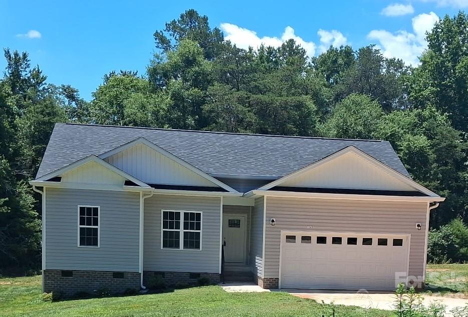 New Price! Come enjoy living outside of the hustle and bustle of the city with no city taxes and no HMO! This new construction home offers just that. sitting on over a half-acre lot, it has 3 bedroom and 2 baths, LVP flooring throughout, crown moldings, arched entryways, kitchen with granite counter tops is equipped with stainless appliances and breakfast bar, Primary bedroom with walk-in closet, en-suite bath with garden tub and separate shower, double vanity. Schedule your appointment today to view this charming home waiting for you to call it home!