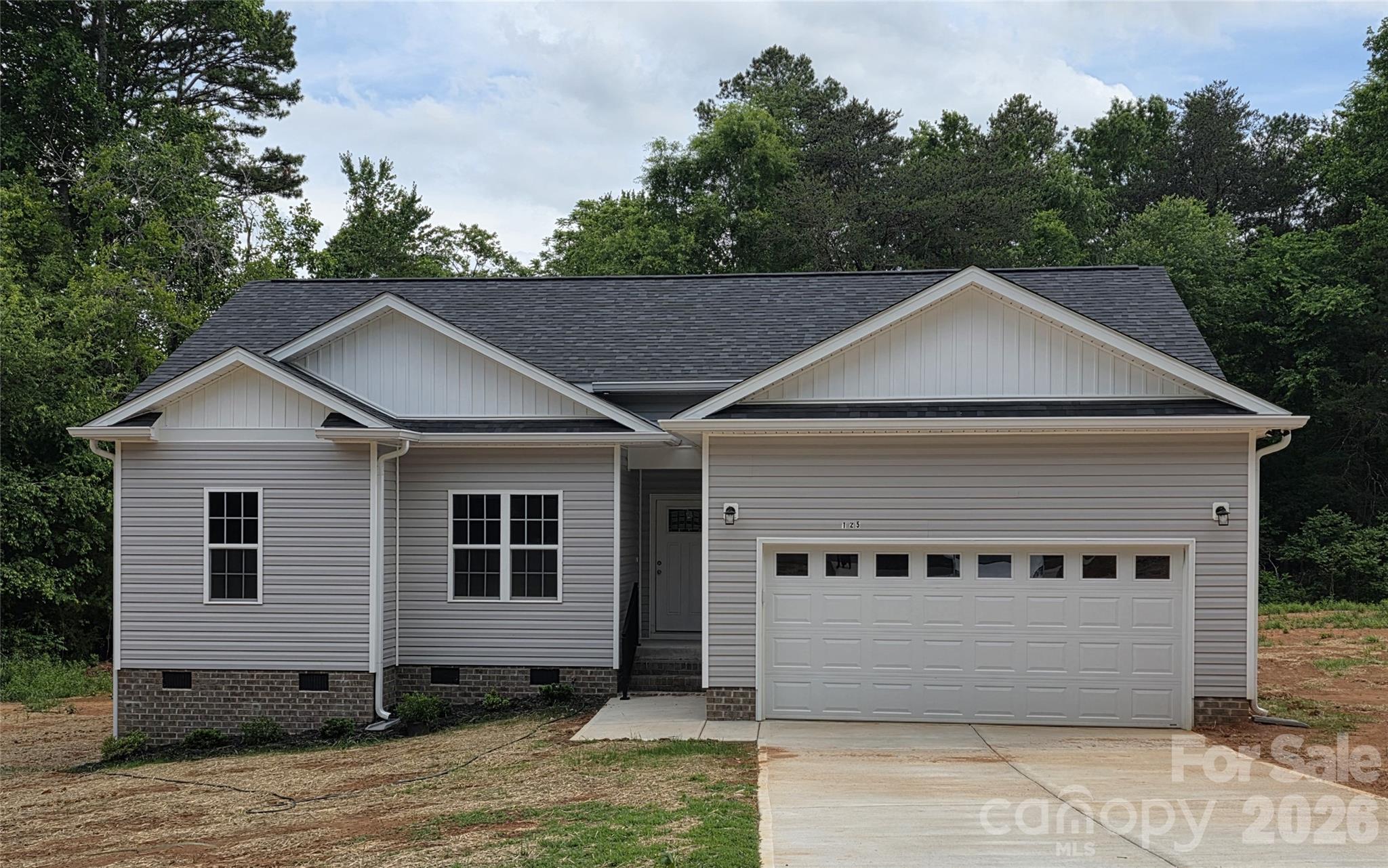 Come enjoy living outside of the hustle and bustle of the city with no city taxes and no HMO! This new construction home offers just that. sitting on over a half-acre lot, it has 3 bedroom and 2 baths, LVP flooring throughout, crown moldings, arched entryways, kitchen with granite counter tops is equipped with stainless appliances and breakfast bar, Primary bedroom with walk-in closet, en-suite bath with garden tub and separate shower, double vanity. Schedule your appointment today to view this charming home waiting for you to call it home!