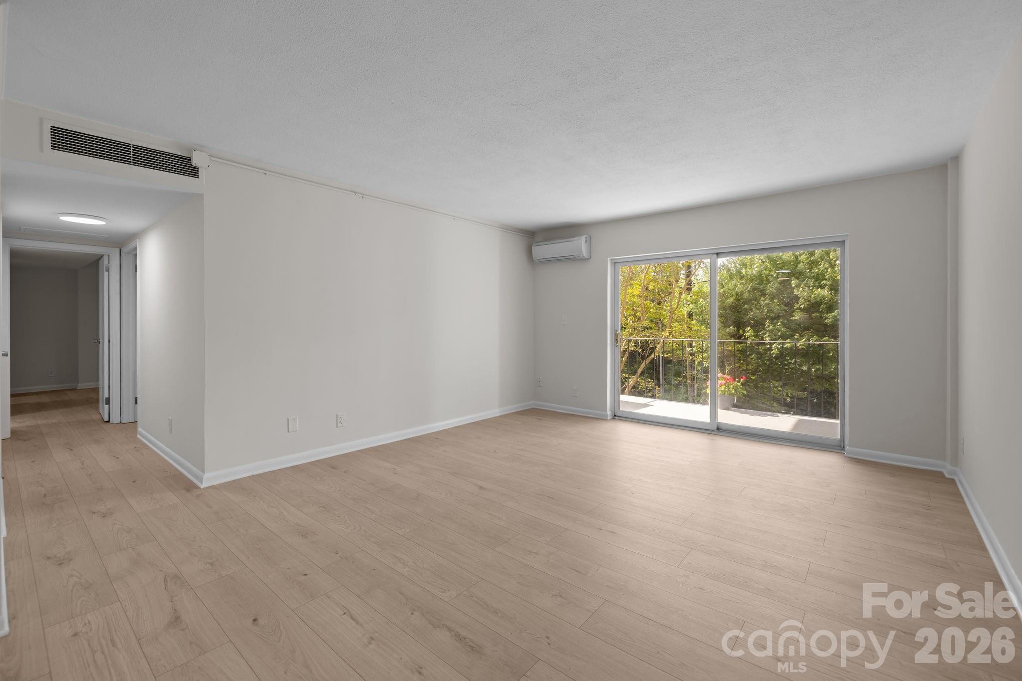 BEST location in town! This stunning, REMODELED 2-bedroom, 1.5-bath condo at Country Club Arms in the heart of MYERS PARK is the one buyers have been waiting for! Freshly painted with NEW flooring flowing seamlessly throughout, the home offers a modern, inviting atmosphere. The open living and dining areas with a charming built-in bar create a bright, airy layout perfect for entertaining, and the kitchen is a true showstopper with NEW quartz countertops, a NEW designer tiled backsplash, and all-NEW stainless-steel APPLIANCES. The spacious primary bedroom features a large walk-in closet and ensuite bath, thoughtfully updated with a NEW tub, NEW tiled walls, and NEW vanity along with a NEW dedicated laundry closet with a NEW stainless-steel washer/dryer combo, an upgrade not found in all units. A roomy second bedroom and a stylishly remodeled powder room round out the space.  Generous storage solutions make everyday living effortless, while community amenities include secure building access, elevator service, a swimming pool, and plenty of parking for residents and guests. Enjoy peaceful views from your private balcony—an ideal retreat— and walk to Reid’s, Selwyn Pub, and more. Situated on a beautiful street next to Myers Park Country Club and just minutes from Uptown, SouthPark, Dilworth, South End, Novant Health, Atrium Health, Queens University, and Freedom Park, this move in-ready condo perfectly blends style, comfort, convenience, and value.