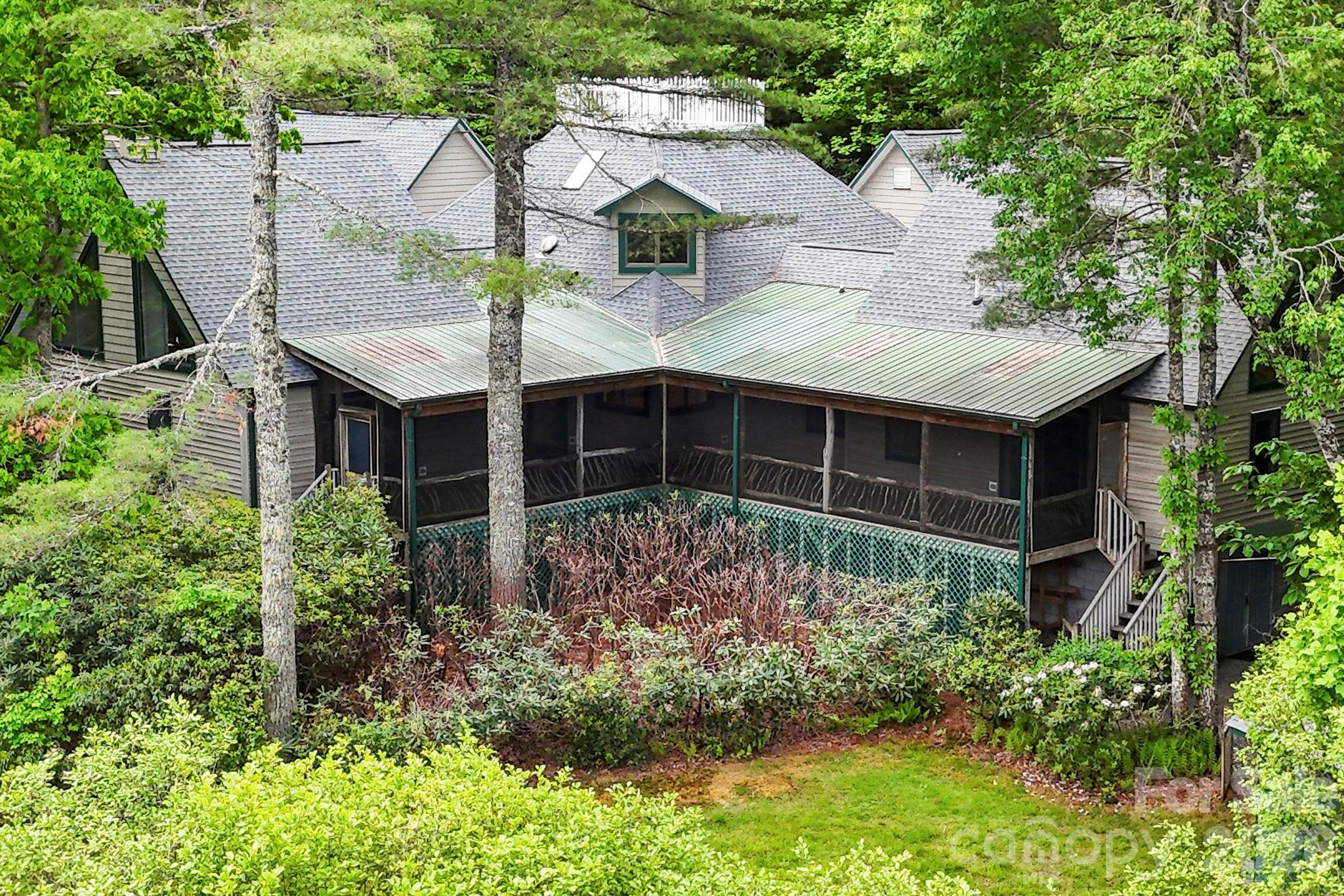 Tucked away in a private mountain community just minutes from downtown Brevard, this extraordinary lakefront retreat offers over 4,000 square feet of thoughtfully designed living space with year-round mountain views and exceptional waterfront living. Featuring three spacious bedrooms, two full baths, and two half baths, this one-of-a-kind home blends comfort, privacy, and natural beauty in one remarkable setting.
Enjoy direct lake access with your own private dock and boathouse, perfect for paddling, fishing, or simply taking in the peaceful surroundings. A charming widow’s walk captures breathtaking views of the mountains and water, creating the perfect spot for morning coffee or evening sunsets.
Inside, the home features a large, well-appointed kitchen designed for gathering and entertaining, along with expansive living spaces filled with natural light. Each bedroom includes its own separate outside entrance, offering ideal flexibility for guests, multigenerational living, or private retreat-style accommodations.
Additional highlights include a spacious three-car garage with workshop area, an unfinished room over the garage ready for future expansion, and an upstairs bonus room perfect for an art studio, office, fitness space, or creative retreat.
Perfectly positioned near both DuPont State Recreational Forest and Pisgah National Forest, this property offers unmatched access to hiking, waterfalls, biking, and outdoor adventure while remaining close to the restaurants, shops, and charm of downtown Brevard.
A rare opportunity to experience lakefront mountain living at its finest.
