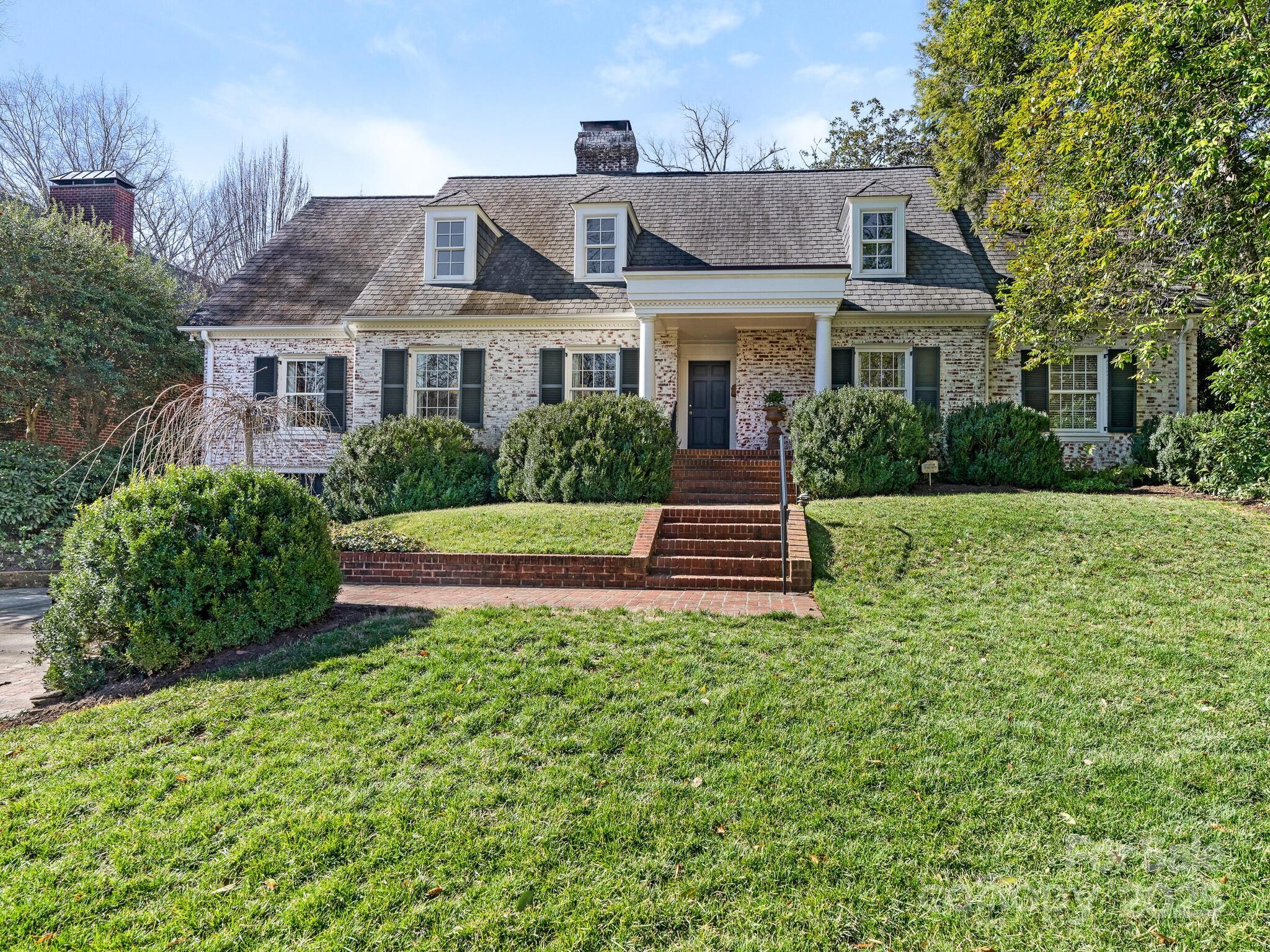 Charming traditional home that is nestled in the heart of Eastover on a private cul de sac. This fabulous home exudes character and charm with endless features. Primary Bedroom on main level overlooks private backyard.  The back staircase leads you to the second floor with a large playroom, office, laundry room and two spacious secondary bedrooms. On the main level the family room opens to the sitting and breakfast area that have multiple windows and french doors . The french doors lead you to the wonderful brick patio and grill area that offers complete privacy. This home is in the perfect location to shops, dining, neighborhood parks and minutes to downtown and SouthPark. This special home will not last long!