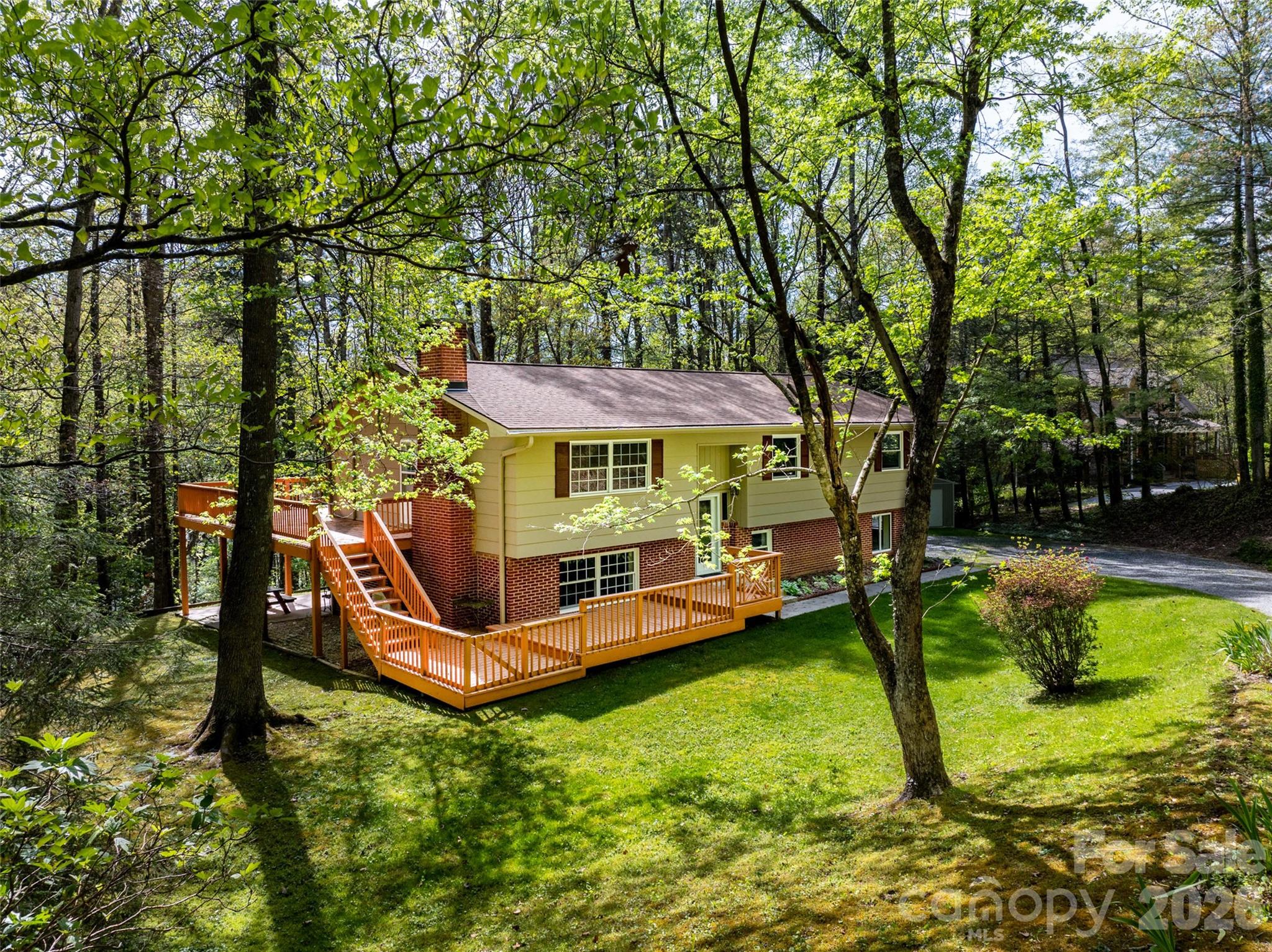 Experience the perfect blend of mountain luxury, adventure, and convenience in this stunning 2,896± square foot retreat nestled in the heart of Western North Carolina. Ideally located near the vibrant communities of Brevard, Hendersonville, and Asheville — and just minutes from Jeter Mountain Farm — this exceptional property offers the ultimate basecamp for outdoor enthusiasts, nature lovers, and those seeking the charm of mountain living.

Surrounded by the beauty of the Blue Ridge Mountains, you’ll enjoy convenient access to premier mountain biking and hiking trails, breathtaking waterfalls, award-winning breweries, wineries, local dining, and boutique shopping. Whether you're seeking adventure or relaxation, this location delivers the best of both worlds.

Inside, the home beautifully combines rustic mountain character with modern comfort and elegance. The expansive floor plan features generous living spaces, a spacious kitchen ideal for entertaining, inviting gathering areas, and cozy, well-appointed bedrooms designed for comfort and retreat.

Step outside and embrace the lifestyle that makes this region so desirable — lush natural surroundings, panoramic mountain views, and abundant outdoor living spaces create the perfect setting for entertaining, relaxing, or simply soaking in the serenity of the mountains.

Don’t miss this rare opportunity to own your own piece of paradise — a true gateway to the beauty, lifestyle, and adventure of the Blue Ridge Mountains.

Listing Agent is Owner.
