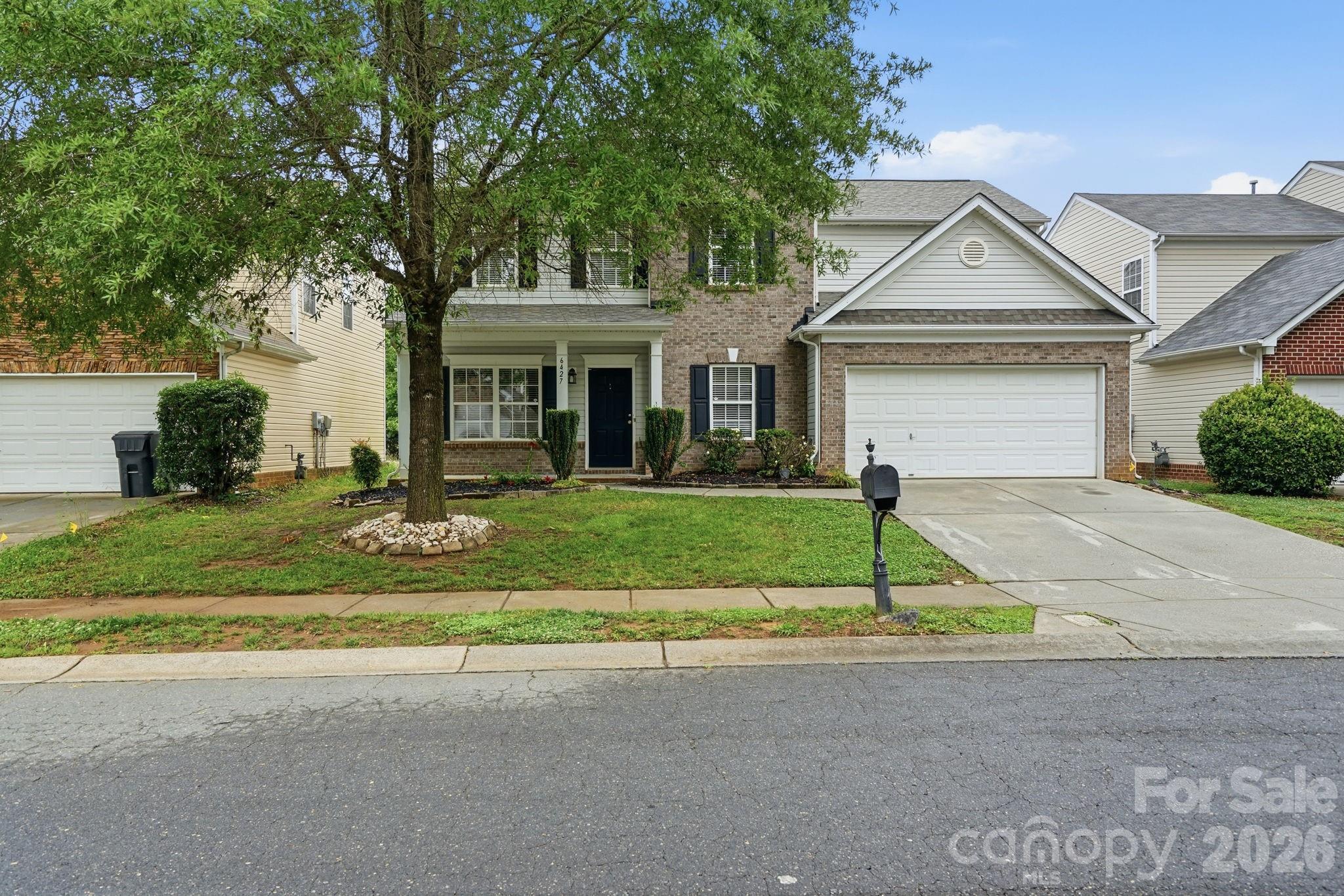 Welcome home to this spacious 2-story residence offering 5 bedrooms and 2.5 bathrooms in a desirable southwest Charlotte location. Recent improvements include a new ROOF, new HVAC units, and fresh interior paint, making this home ready for its next owner. Inside, you'll find a comfortable layout designed for both everyday living and entertaining. The living room features a cozy fireplace, while the formal dining room is accented with crown molding, providing an elegant space for meals and gatherings. Generous bedroom sizes offer flexibility for guests, remote work, or additional living needs. Enjoy convenient access to shopping, dining, and recreation, including Lake Wylie, McDowell Nature Preserve, and Charlotte Premium Outlets, with easy connectivity to Uptown Charlotte and Charlotte Douglas International Airport. One or more photo(s) was virtually staged.