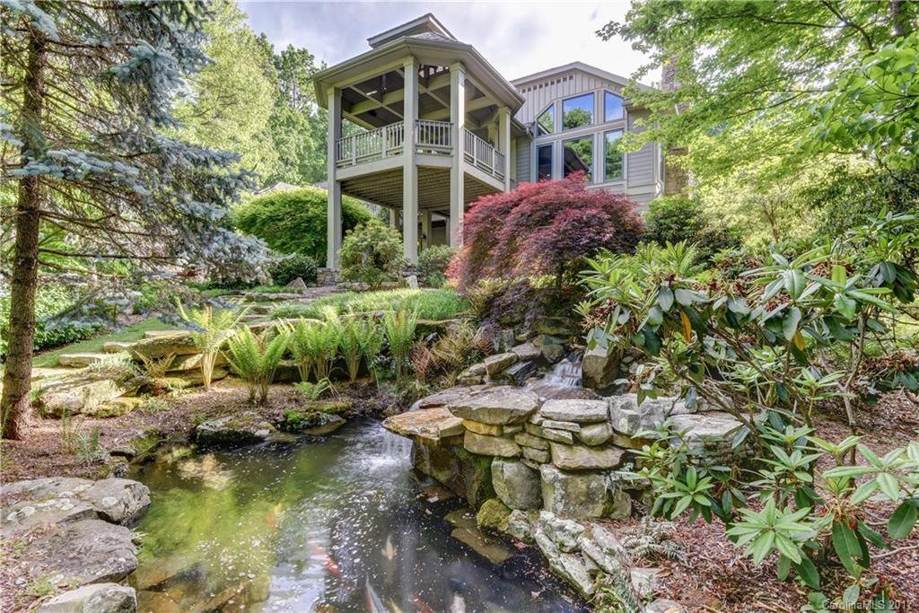 A hallmark of design & quality w/ ultimate privacy. Main level living featuring oak HWD floors w/ black walnut inlays, beamed & coffered ceilings, library, DR, great rm w/ stone FP, gourmet kit w/ island & butler's pantry, luxurious master suite, expansive laundry room & mud rm. The LL features a family rm, billiard area, full bar, card rm& 2 guest suites. Outdoor living options include the gazebo-style covered deck, open deck, stone patios, cascading waterfall w/ Koi pond & lush landscaping.