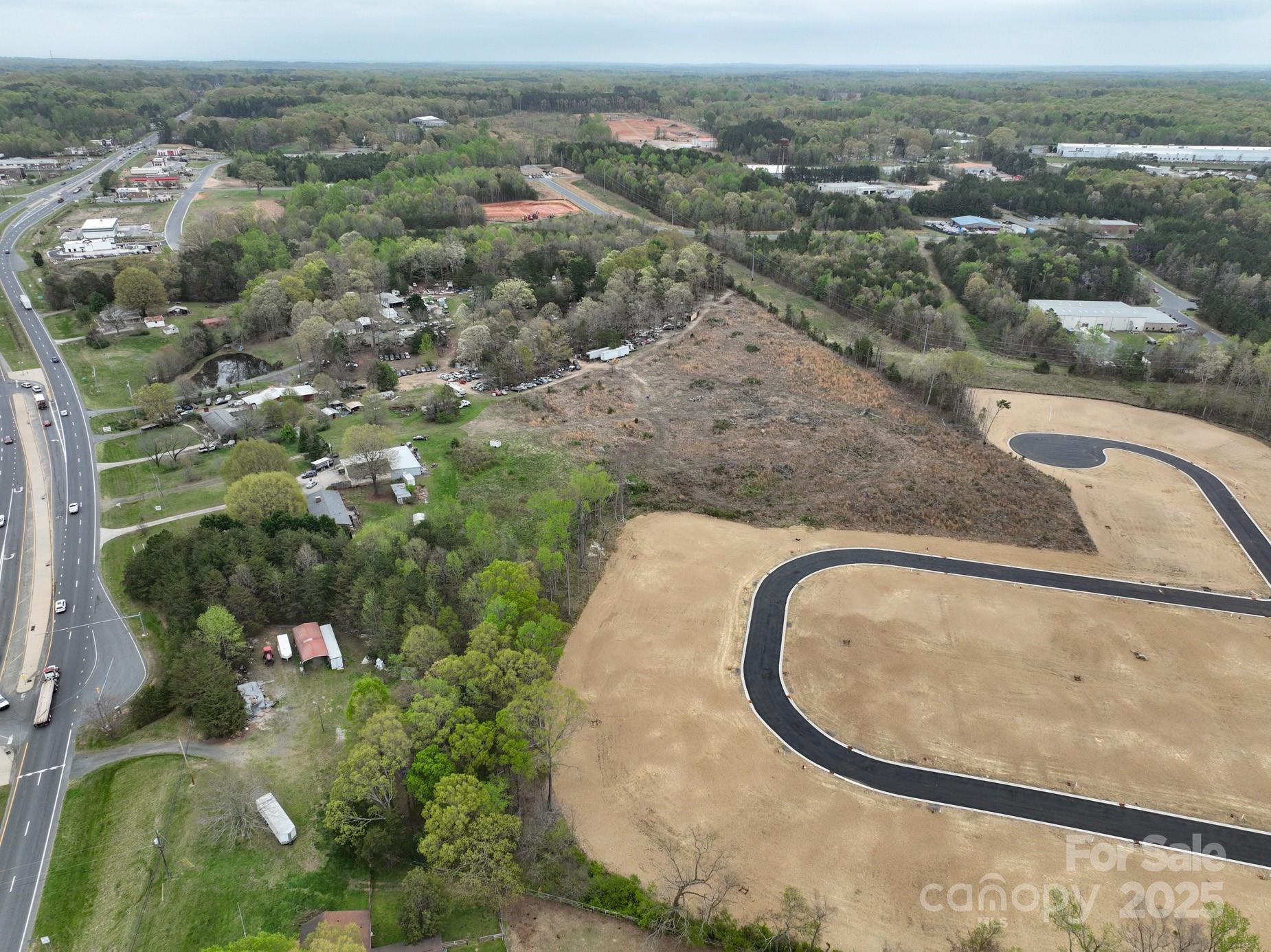 Great investment opportunity in a prime location! It is predicted that Western Stanly County will experience a 64% increase in population by 2030. Locust is the center of retail in Western Stanly County and is rapidly growing. This parcel is located on a four lane highway, bordering Stanly and Cabarrus Counties with easy access to Highway 601, Highway 200 and only 16 miles from Interstate 485. What a great investment opportunity and ideal location for a grocery store, shopping center, restaurant or retail space. It is located in the Town of Locust and directly across from Red Bridge Golf Course and Walmart Shopping Center. Public water and sewer available.