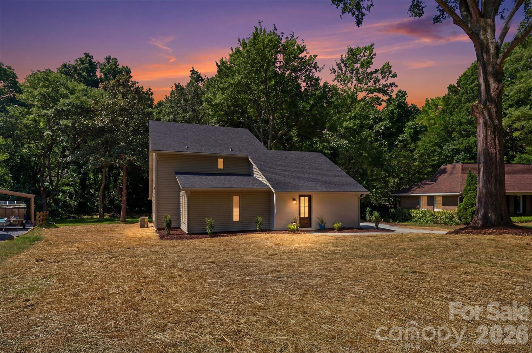 Welcome to 5908 McNair Road, a fully remodeled home where luxury finishes meet everyday functionality. Ideally situated with quick access to Uptown Charlotte, major highways, shopping, dining, and entertainment, this location offers the perfect balance of convenience and accessibility. Inside, you'll find a thoughtfully redesigned floor plan featuring brand-new luxury flooring throughout, a stunning custom kitchen with solid wood cabinetry, waterfall island, and high-end finishes, beautifully updated bathrooms with real marble tile, and countless modern upgrades. The home's dynamic layout offers the perfect blend of openness and versatility, allowing each space to be tailored to your unique vision of living, entertaining, working, or relaxing. Additional upgrades include brand-new windows, a brand-new roof, white oak stairs, and designer details throughout. This move-in-ready home combines style, flexibility, and location in one exceptional package.