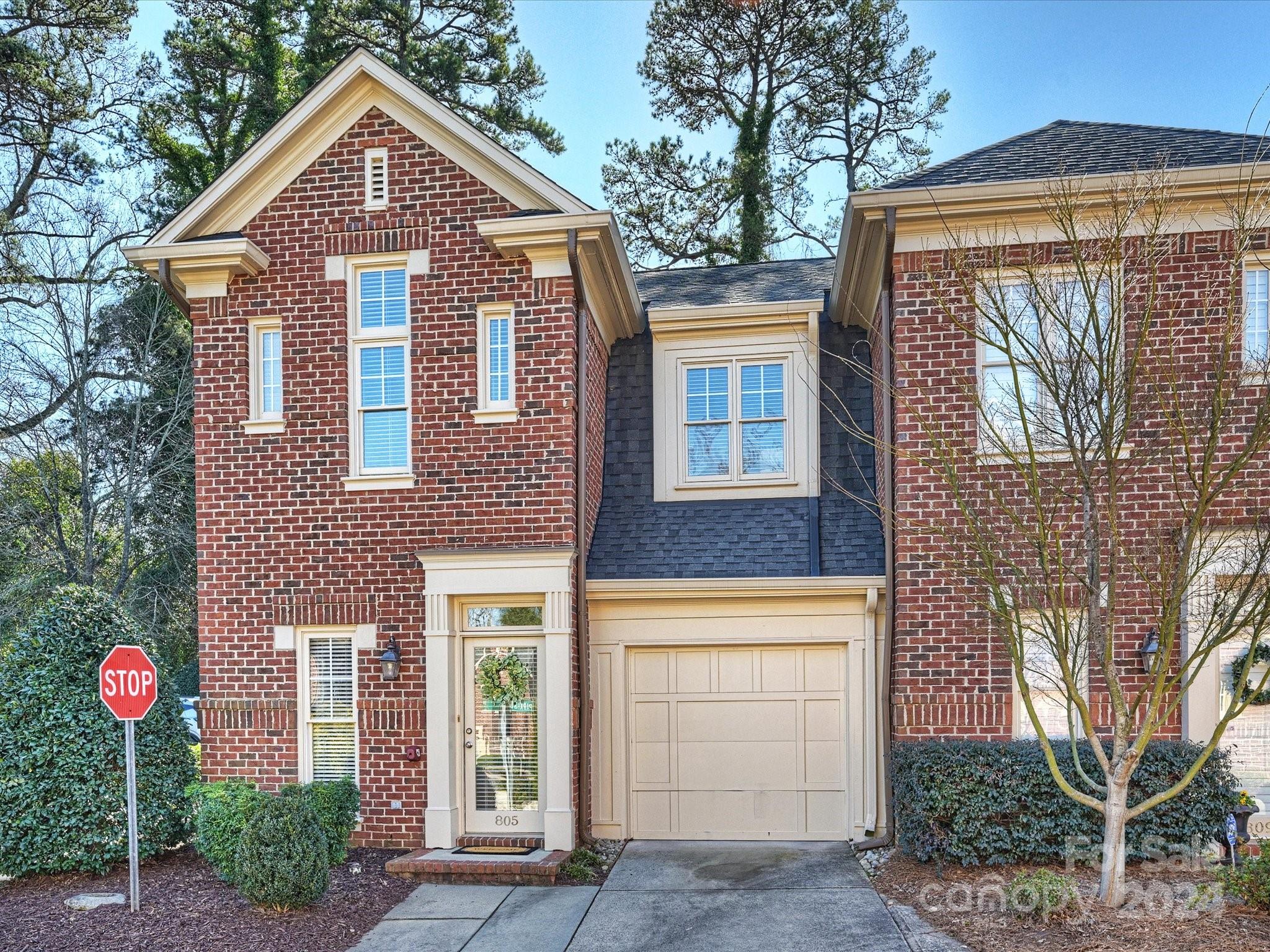 Beautiful end unit in the amazing location of Hillside West. This 2-story brick townhome has an open floorplan with a large enclosed paver patio and an attached garage. Wonderful light with extra windows in this end unit. Kitchen has stainless steel appliances, granite countertops, gas range, breakfast bar, window seat in dining area and a gas fireplace in the family room. Upstairs, NEW wide-plank vinyl flooring, NEW carpet on stairs, NEW paint throughout including garage, ceilings, trim and doors. Primary bedroom has closet system and updated bathroom. Fabulous high ceilings in secondary bedroom. Ready to move right in and be close to the best shops and restaurants in the Myers Park & Dilworth areas!