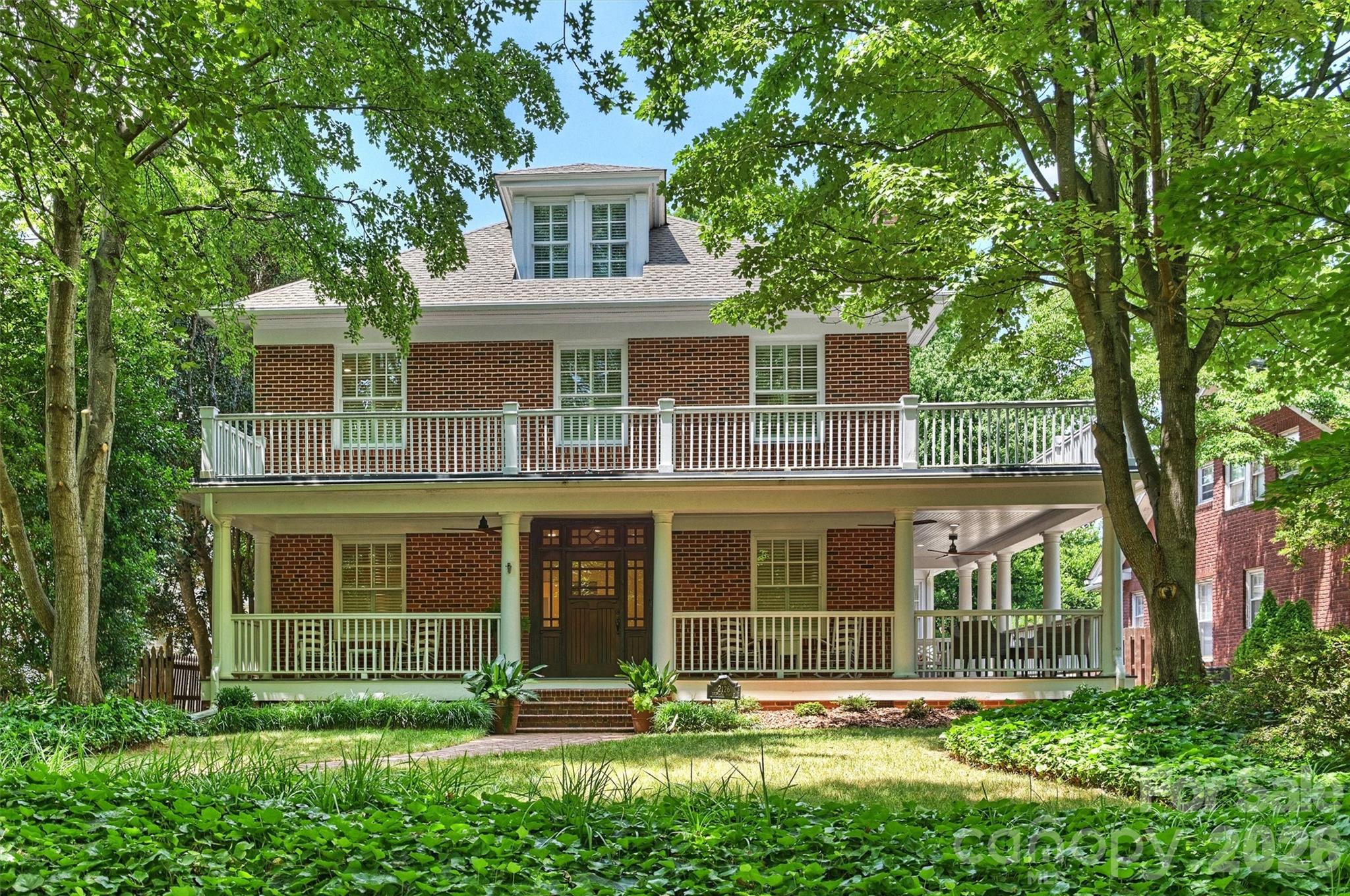 Located in the heart of Historic Dilworth — one of Charlotte's most beloved and walkable neighborhoods — this stately two-story brick home is a rare find. Wide-cased openings, high ceilings, gleaming wood floors, and handsome moldings speak to the home's timeless character, while thoughtful updates bring modern comfort throughout.

The main level flows beautifully from the gracious living room to the formal dining room, a well-appointed kitchen, and a welcoming family room. Wraparound porches on both the first and second levels are perfect for morning coffee or evening entertaining. The kitchen is a cook's dream: a large work island with breakfast bar that seats six, a Wolf gas cooktop and double wall ovens, and a Bosch dishwasher. Here you also find a gas fireplace,  two beverage coolers and a wet bar.

Quiet retreats include a sunny sunroom and a dedicated home office. Upstairs, the spacious primary suite offers a fireplace and opens to the second-floor porch. The laundry room has nice counter space and plenty of storage. The third level adds a bonus flex space and a 5th bedroom and bath — ideal for an au pair, guests, or a private studio.

Additional highlights: new roof (2026), full crawl space and basement encapsulation, charming porches off the family room and a secondary bedroom. Steps from Uptown Charlotte, the light rail, and the vibrant shops and restaurants  of both Dilworth and SouthEnd. Walk to everything. Live beautifully.


INTERIOR PHOTOS WILL BE UP 6/19