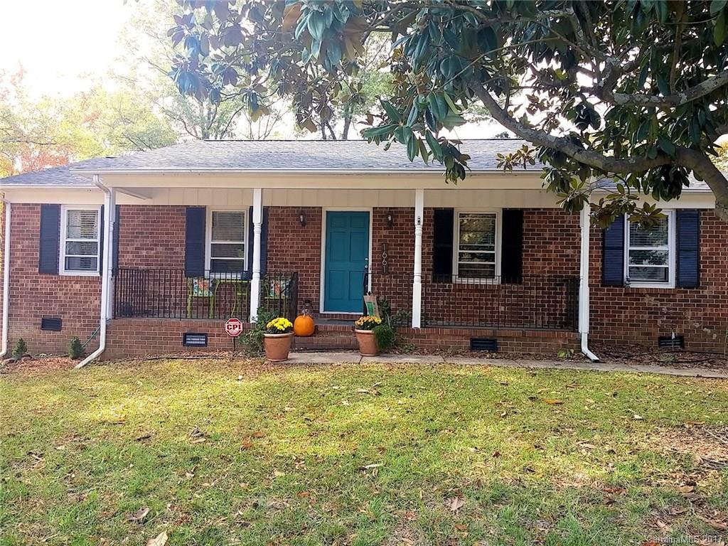 Charming brick ranch home! 3 bedrooms & 2 full baths.  Great location - convenient to shops and restaurants. Updated floorplan with beautiful hardwood flooring, new carpet in all bedrooms, new tile in kitchen. Updated bathrooms including new toilets. Formal Living and Dining rooms PLUS a Family room with a stone fireplace.  Open kitchen with breakfast bar, stainless steel appliances, Solid Surface counters with tile backsplash. Spacious master with renovated masterbath.  Fenced back yard.