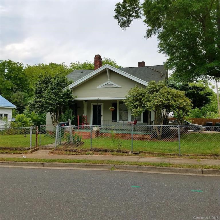 This nice bungalow style home featuring 3 bedrooms and 1 and a half baths on a corner lot.  The home has a large kitchen, separate dining room, and living room with high ceilings throughout. The property also has a large workshop in the back yard and a fence for added privacy.  Convenient to schools, shopping, and the interstate.