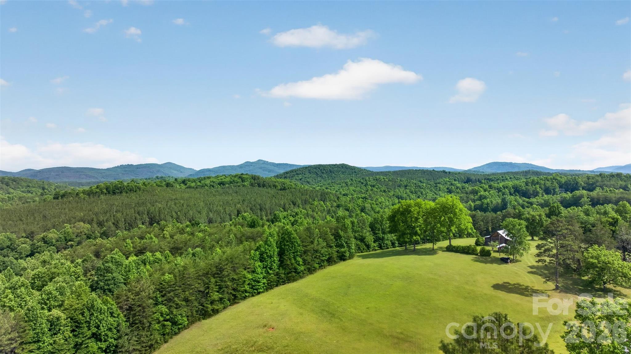 247.46 Acres | Union Mills, NC | Historic Frontier Cabin | Mountains, Creeks & Pasture
There are properties you buy. And then there are properties that find you.
This is the latter.
Tucked into the mountains of Rutherford County, 247.46 acres of pure, untouched North Carolina waits for the person who's been quietly dreaming of something more — more space, more silence, more life. Not a subdivision lot. Not a neighborhood. Not an HOA newsletter. A place where the only thing on the horizon is mountain views, and the only sound at dusk is water moving over rock.
The land has it all: sweeping mountain views that stop you in your tracks, open pasture, hardwood forest, and creek frontage that would make a grown man stop and just breathe. Whether you're a hunter looking for your own private ground, a horseman wanting room to roam, or simply someone who has had enough of the noise — this land meets you where you are.
At the heart of it stands a cabin that defies modern time. Built in the 1700s or early 1800s, this cabin features a main room anchored by a beautiful fireplace with a kitchen and full bath. It is a living relic of American frontier life in these mountains. Look closely at the walls and you'll find the original rifle ports — narrow openings hand-cut by the settlers who built this place and defended it. This isn't a cabin that was decorated to feel historic. It is history. It has earned its age. Every notch and worn plank tells a story most people will never get to touch.
In a world that moves faster every year — where the headlines are relentless, the cities are louder, and privacy feels like a luxury — land like this has become something else entirely: a refuge. A reset. A place to raise your kids the way you were meant to. To hunt your own ground. To sit on a porch in front of a cabin that was standing before this country was what it is today, and feel something settle inside your chest.
The seller will not subdivide. This land sells whole, 247.46 acres, one piece, one legacy, one opportunity.
Some things are worth protecting. This is one of them.