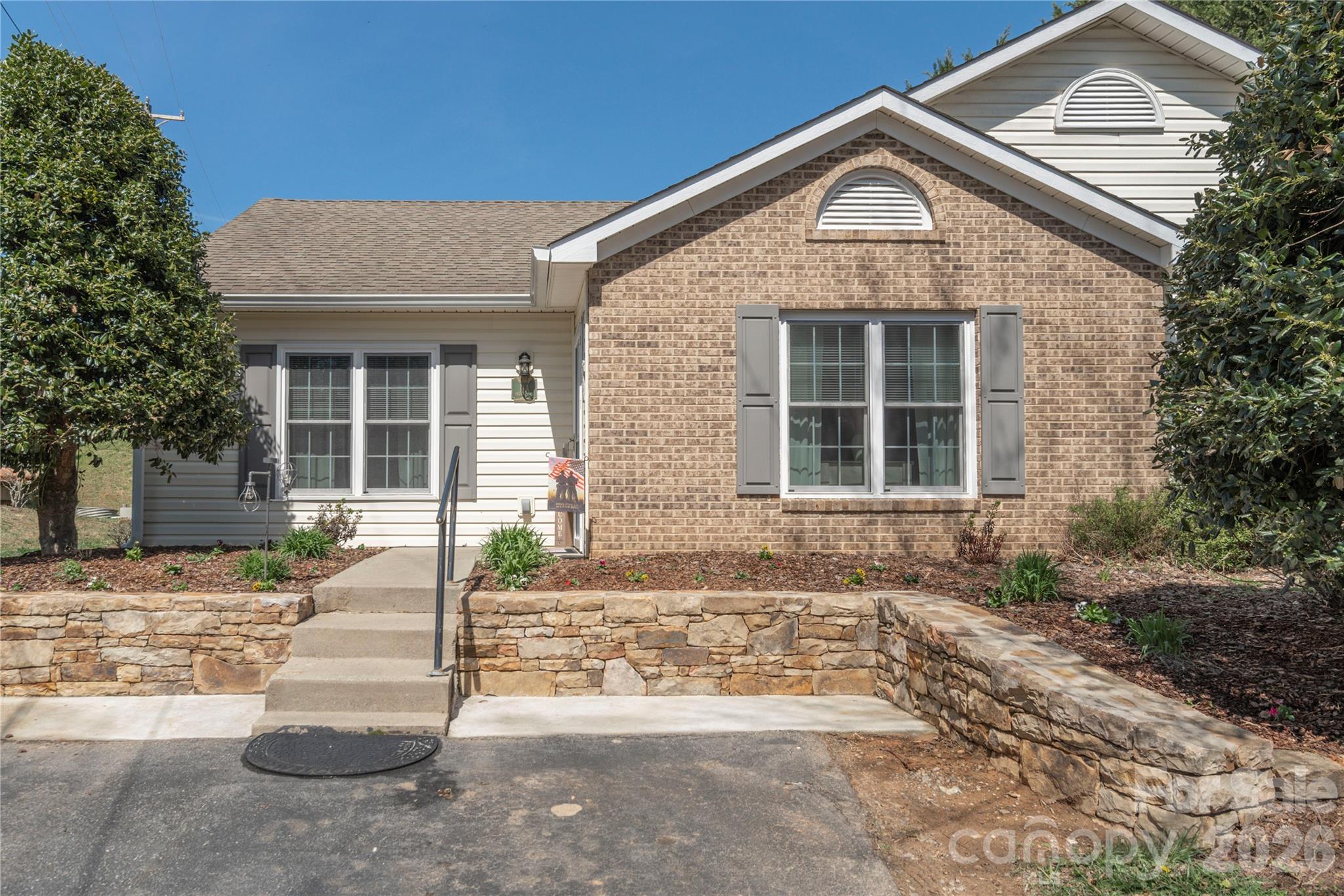 This beautifully updated 2-bedroom, 2-bath townhome in Black Mountain offers 1,086 square feet of thoughtfully renovated living space with modern upgrades throughout. The completely remodeled kitchen features new cabinetry, countertops, sink, faucet, and all-new appliances, including a dishwasher and stove. Stylish vinyl plank flooring flows throughout the home, while every window, storm door, and closet door has been replaced for added efficiency and appeal.

Both bathrooms have been tastefully remodeled with new vanities, sinks, and showers, and the primary bath features a charming barn door accent. Enjoy outdoor living in the fully fenced, private backyard — perfect for relaxing, entertaining, or pets. The upgraded storage shed includes added trusses for additional storage space.

Major system updates provide peace of mind, including a new heat pump, new hot water heater, and a new roof installed in June 2025. Move-in ready and conveniently located near the shops, dining, and outdoor recreation that make Black Mountain so desirable.
