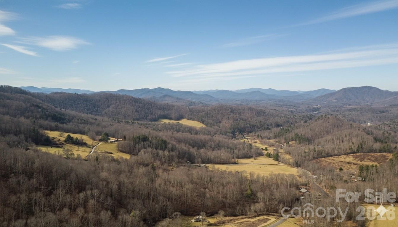 Elevated Living at The Orchard at Green Cove
The View You’ve Been Dreaming Of
Experience the pinnacle of Blue Ridge Mountain living. This premier homesite in The Orchard at Green Cove offers a rare combination of high-country seclusion and refined community character. The "Turkey Pen" view provides a breathtaking, multi-layered panorama of rolling hills and distant peaks that shifts beautifully with the seasons—from the vibrant greens of spring to the crisp, clear blues of a Carolina winter.
Property Highlights
Location: Situated in the exclusive Orchard at Green Cove, a private residential enclave accessed via North Mitchell Avenue and Green Cove Road.
The Setting: Nestled in the heart of the Cane Creek valley area, offering a peaceful, pastoral atmosphere surrounded by high-elevation hardwood forests.
Neighborhood Prestige: Join an established community of high-value, single-family homes (with nearby properties valued in the $600k+ range) on sought-after quiet drives like Apple Farm Road and Wild Turkey Gap.
Adventure at Your Doorstep: Minutes away from the world-renowned Roan Mountain Recreation Area, famous for its rhododendron gardens and the Appalachian Trail.
The Best of Both Worlds
While it shares the serene, apple-growing heritage of the region, please note that this is a private residential community—offering a quiet sanctuary away from the tourist bustle of the Parkway, yet close enough to enjoy the local arts and culture of Bakersville and Spruce Pine.