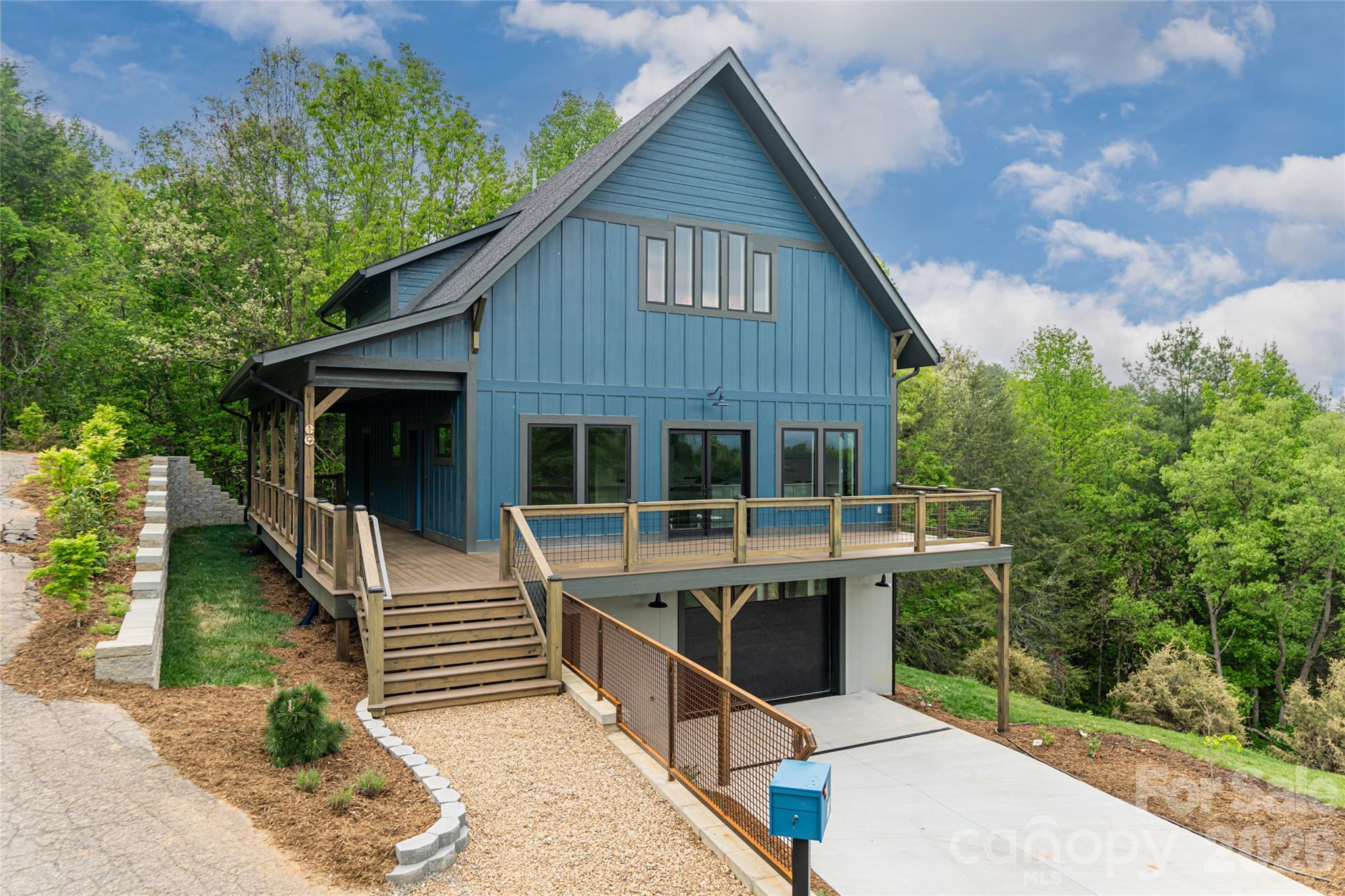 This thoughtfully designed eco-friendly home offers a balance of modern comfort and sustainable living. Featuring three spacious bedrooms, three full baths and a half bath, the layout provides functionality and privacy, while a dedicated office creates an ideal work-from-home space. A versatile bonus room adds flexibility for a media room, playroom or workout space and there is also a well-lit office downstairs. Energy-efficient systems, quality green materials, and abundant natural light enhance comfort and efficiency throughout the home. Enjoy mountain views from the spacious deck outside or relax by the firepit on a beautiful night. This home is just minutes from downtown Weaverville and Asheville. This home has been built to green standards and the certificate is being pursued.