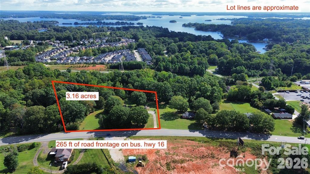 This gorgeous 3.16 acre property is located right in the heart of Denver and has 265 feet of business highway 16 road frontage. This property offers exceptional potential for future development. Currently this property has a full brick home on it with 3 bedrooms, 2 bathrooms and it's 1,500 sq. ft. Home is AS IS. This property has multiple out buildings. This site is zoned Residential Single Family with the East Lincoln District Overlay. According to Lincoln County's Future Land Use Plan, this property is designated for business use, making it a great candidate for conversion or redevelopment. Average daily traffic count is 17,000. PLEASE DO NOT WALK THE PROPERTY WITHOUT CONTACTING AGENT. No pictures of the inside of the home.