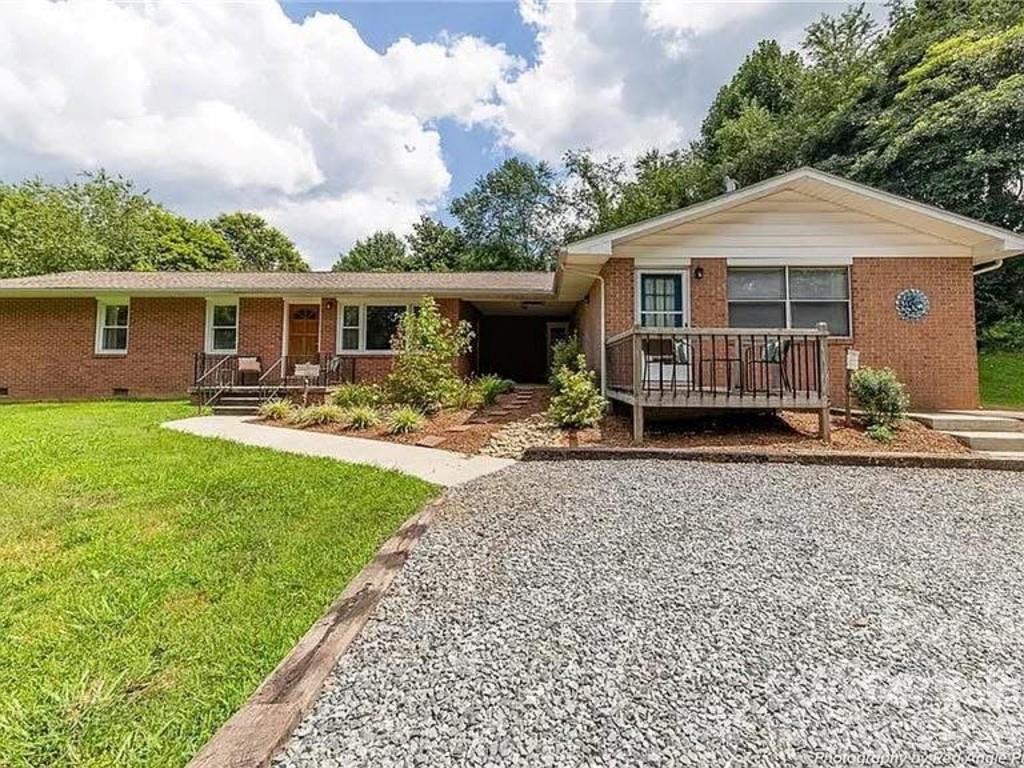 Nestled on 1.58 beautiful acres in the heart of Mills River, this charming ranch-style home offers the perfect blend of space and comfort. Featuring 4 bedroom and 2 baths total in a duplex style or mother in law suite opportunity. One side offers 3 bedroom 1 bath with updated kitchen and hardwood floors while the other side offers 1 large bedroom that opens to an office and sitting area while the bedroom opens to an in suite bathroom. 
Enjoy the tranquility of a spacious lot while still being just minutes from local restaurants, breweries, shopping, and outdoor recreation. The expansive yard offers endless possibilities for gardening, entertaining, play or simply relaxing by the fire pit and taking in the peaceful surroundings. 
Whether you're looking for your forever home or a place to have rental property, this Mills River gem combines the convenience of one level living with the beauty of Western North Carolina. 
See also MLS#4400693
