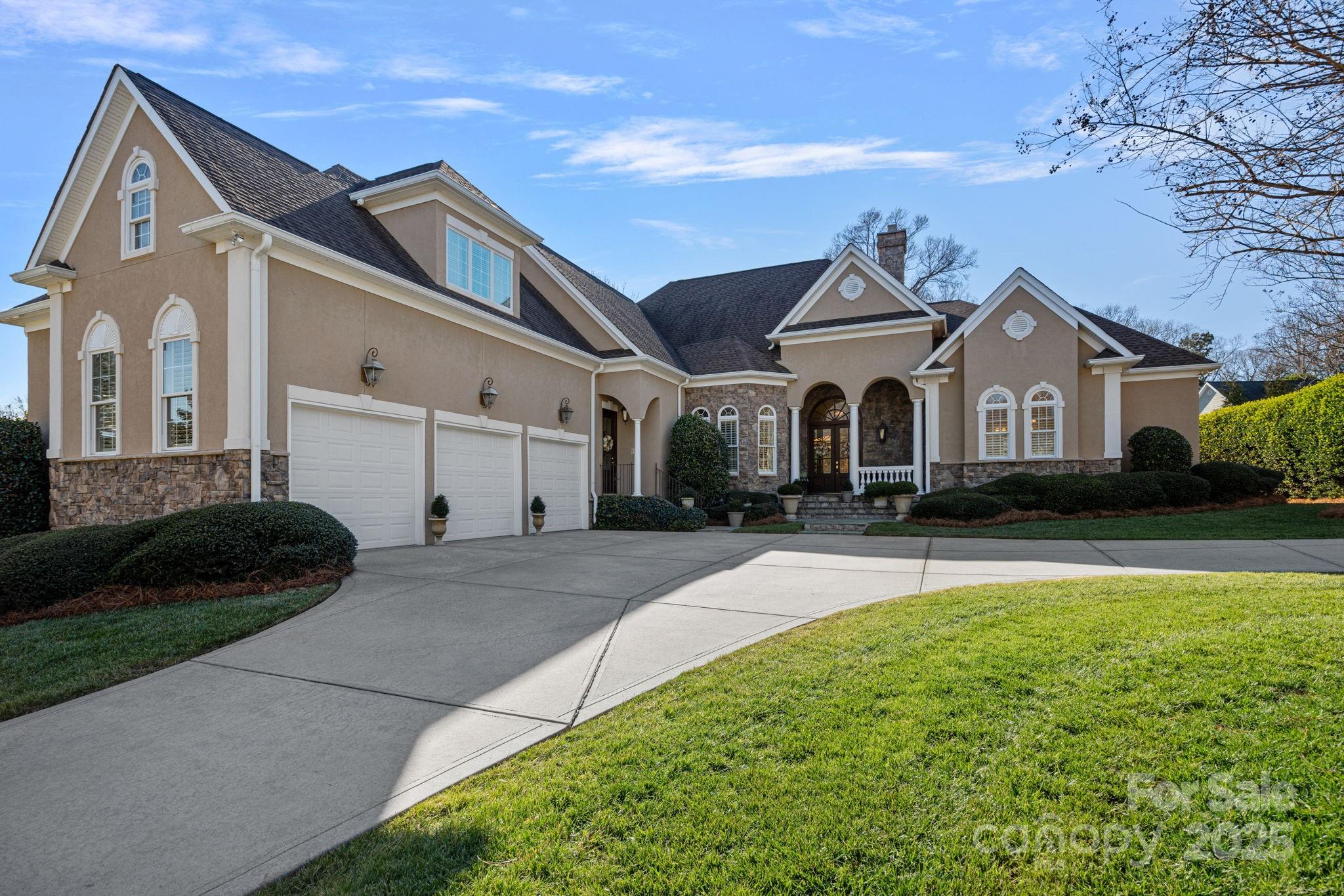 Welcome home! This stunning home was customed designed by the owners to capture all the charm of the historic Fort Mill Belk-Mack home they once called home, but w/modern conveniences of a newer build. Soaring ceilings, extensive moldings & trim, gracious formal entertaining spaces, three gas fireplaces with traditional mantels- just a few of the fine details of this home. There truly is not another home like it! This is made for one-floor living, with additional upstairs bonus room outfitted as "the library" with an additional full bath+ walk in closet. This could be a guest rm, playroom or office - depending on your needs! Every room is warm and inviting, and the double french doors that lead to the porch, patio, and back yard showcase a private garden filled w/a variety of mature hydrangeas. Kitchen offers ample work space with two islands for prep space plus a breakfast bar, full breakfast table space, bar area with wine cooler, and desk space. 0.8 miles to main street retail!