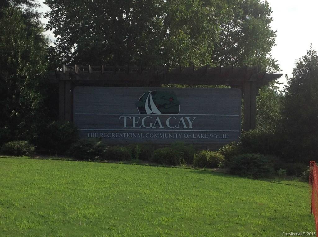 Private wooded lot in quiet cul de sac off Point Clear in beautiful old Tega Cay. Friendly neighbors and safe area. Are amenities include a wonderful lifestyle experience with boat ramps, tennis courts, swimming, lake lifestyle, club house, gym, golf club, parks, walking trails and more. Tega Cay is a wonderful place to live with great schools, shopping and restaurants in the neighborhood. If you are considering building, Tega Cay is a fantastic place to live.