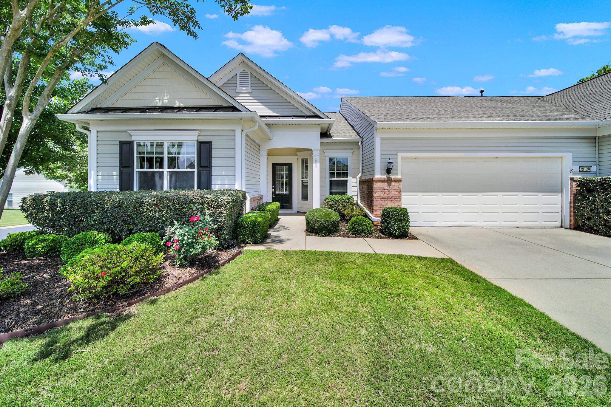 Priced to SELL! Cozy END unit Berkley Villa w/2 car garage, freshly painted, cleaned, & MOVE-IN ready in 55+ Sun City Carolina Lakes golf community. Nestled on a quiet street within walking distance to restaurants, shopping, groceries, medical & more. Entry foyer opens up to spacious great room with separate dining area, accented with wainscotting & lots of natural light. LVP wood flooring flows throughout main living. A quaint breakfast nook sits at the front of the home & offers bistro seating, pantry & breakfast bar. This split bedroom floorplan includes a primary bedroom featuring a large walk-in closet & ensuite bath w/walk-in shower. A guest bedroom is positioned at the front of the home, perfect for visitors or to use as an office/hobby room. Relax daily while sitting on your back covered deck w/ceiling fan. Refrigerator & washer/dryer included! This active lifestyle community offers resort style amenities featuring multiple pools, clubhouse, tennis, pickleball, dog park, social clubs & more! SELLER OFFERING TO PAY Remainder of 2026 HOA Dues with acceptable offer.